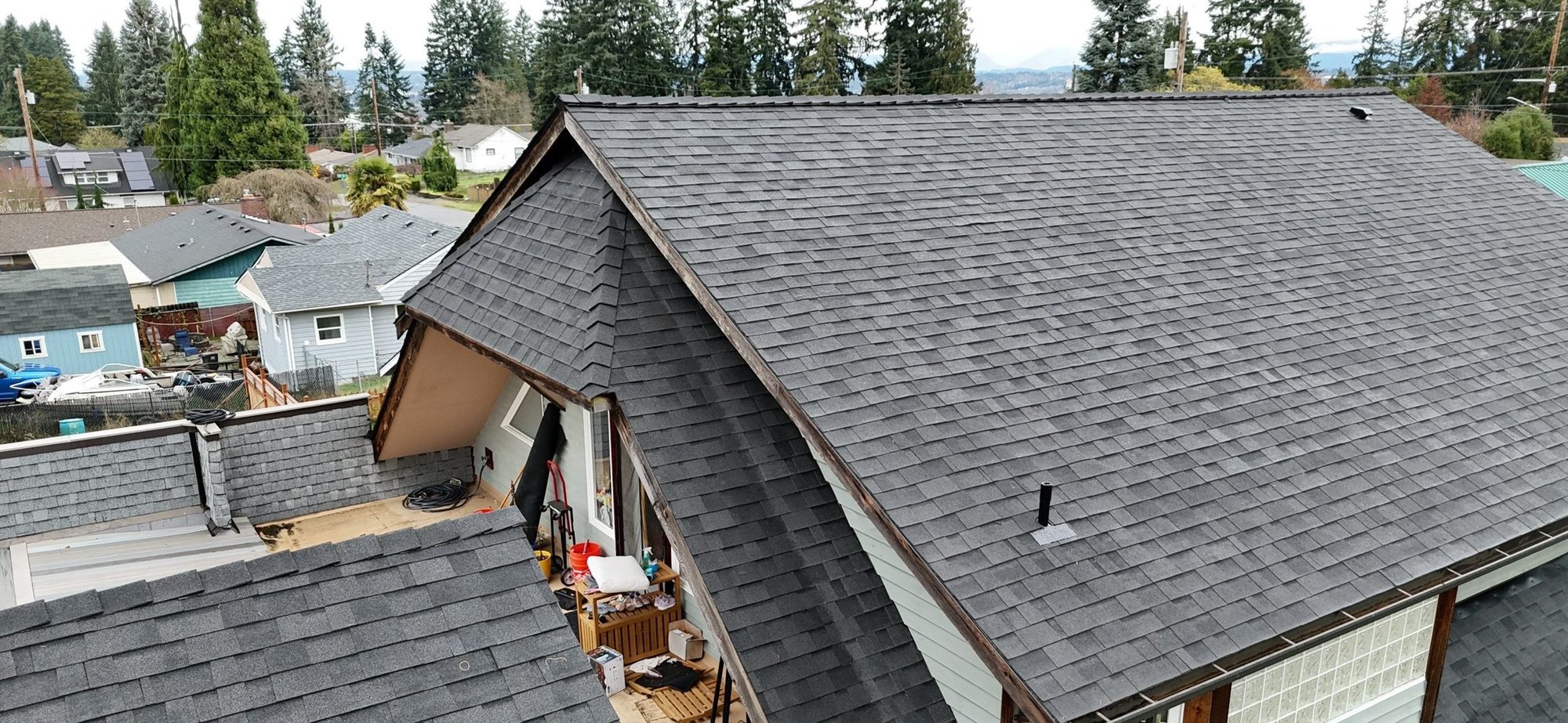 Drone view of the finished Malarkey Midnight Black asphalt shingle roof, Everett, WA, by Amor Roofing