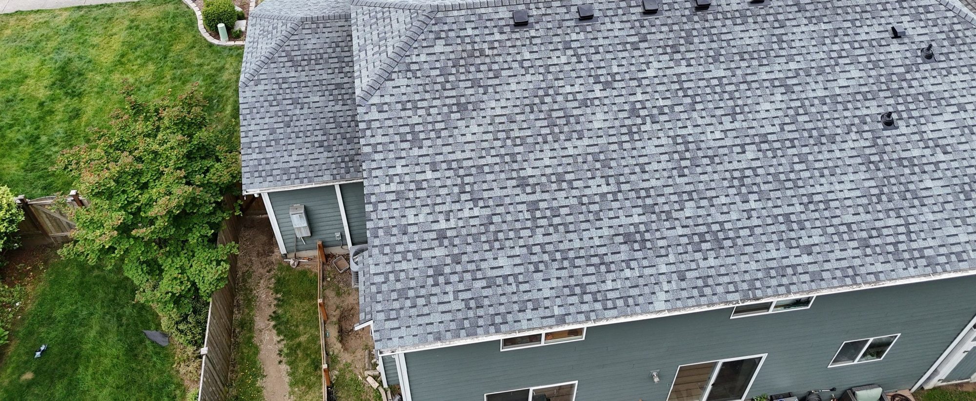 Aerial over the Pabco Premier Pewter Gray asphalt shingle roof from the side, Marysville, WA