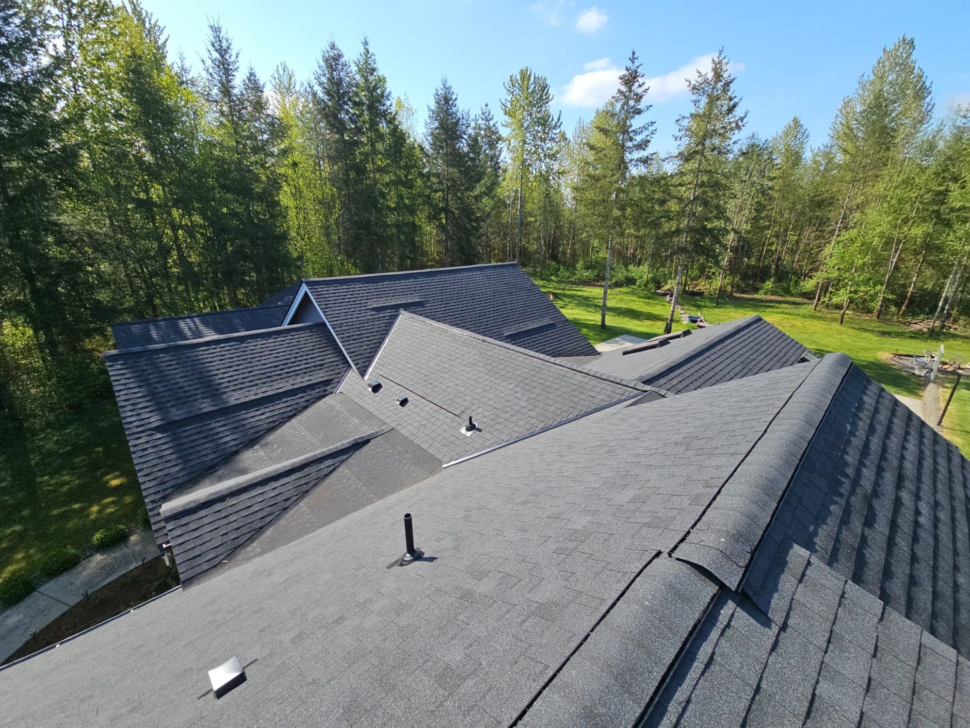 Intersecting hips and valleys on the completed asphalt roof, Lake Stevens, WA