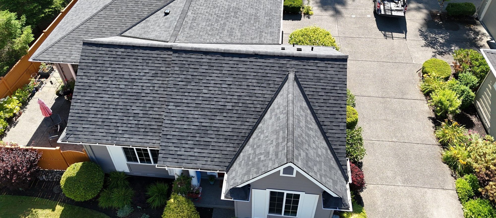 Top-down aerial of the Malarkey Highlander Midnight Black asphalt shingle roof over the front gable, Redmond, WA