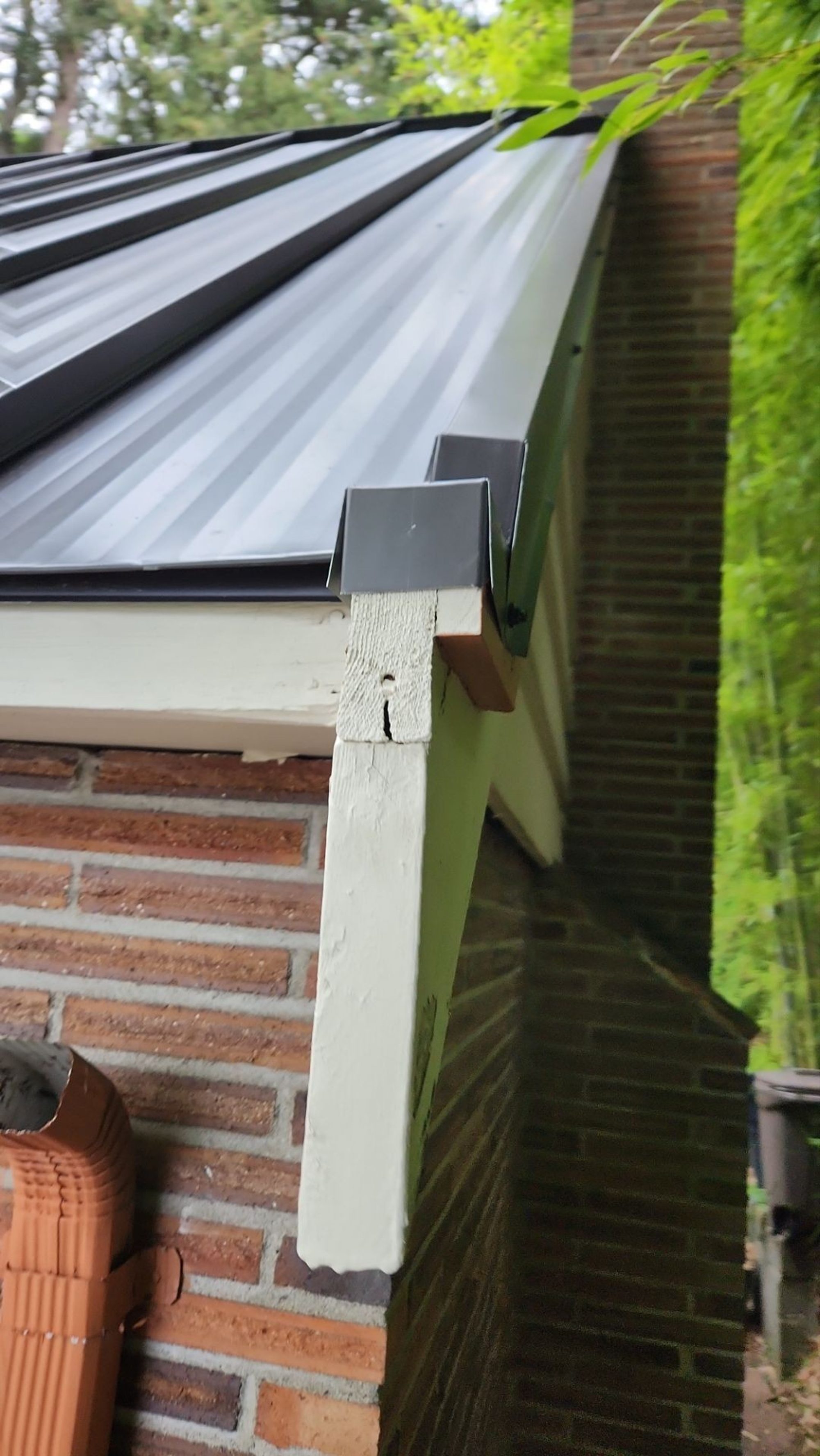 Chimney flashing detail on the Dark Bronze standing seam metal roof, Bellevue, WA