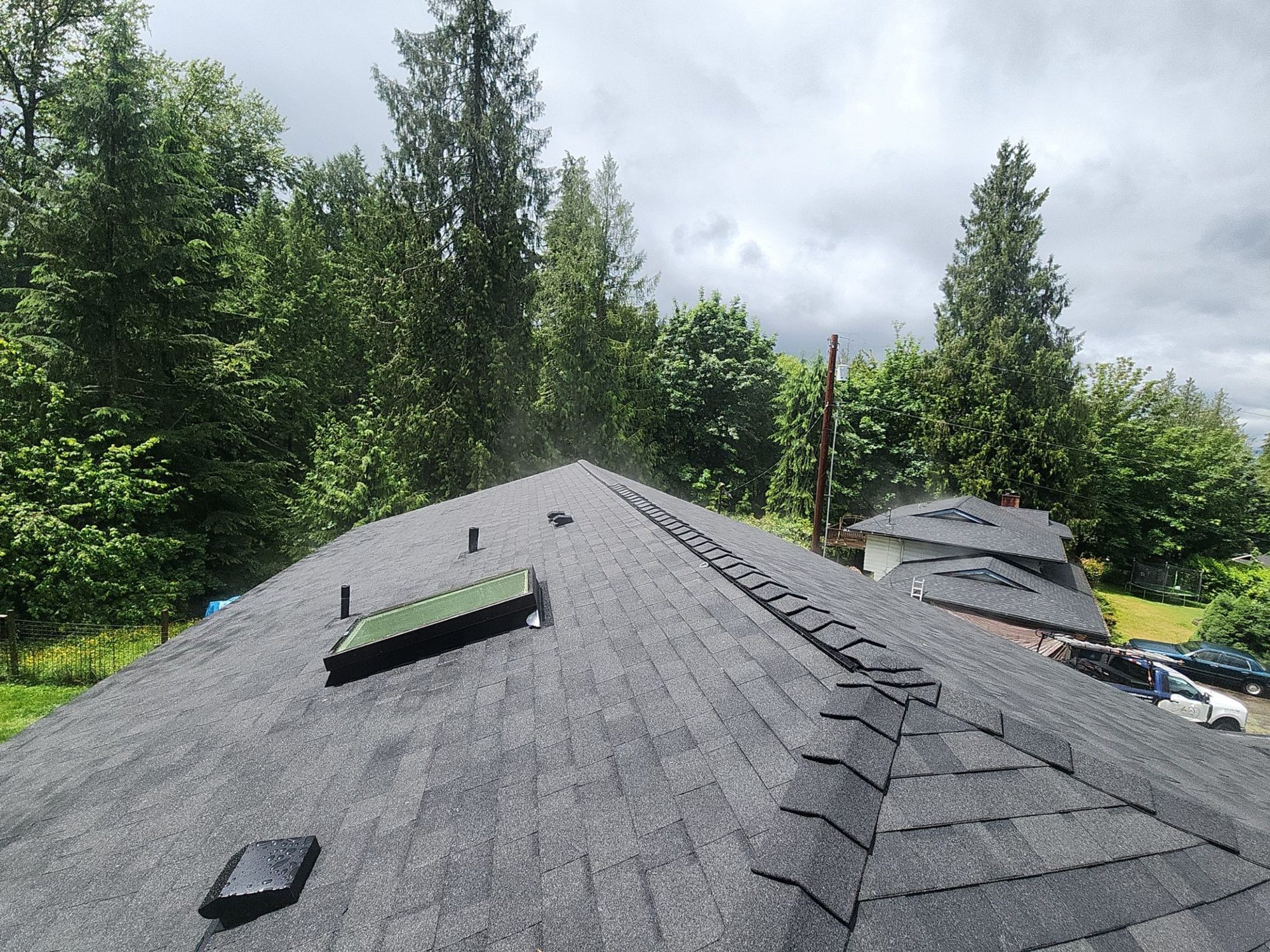 Finished Malarkey Legacy Midnight Black asphalt shingle roof with ridge vent and skylights, Lake Stevens, WA
