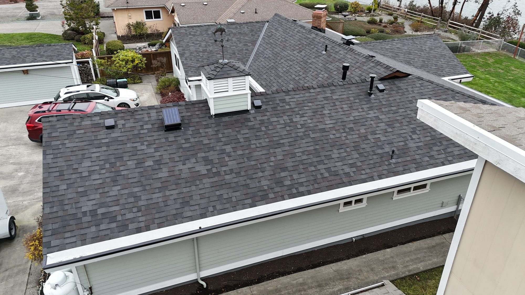 Amor Roofing Black Oak asphalt roof in Camano Island, drone roof planes cupola