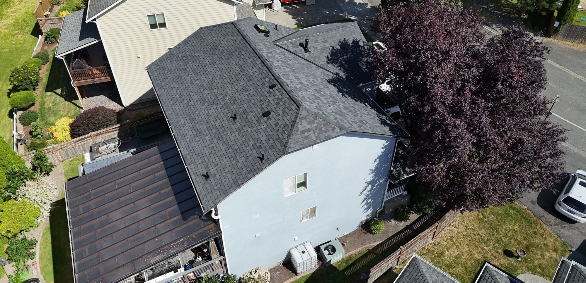 Drone view of the finished Malarkey Midnight Black asphalt shingle roof, Marysville, WA, by Amor Roofing