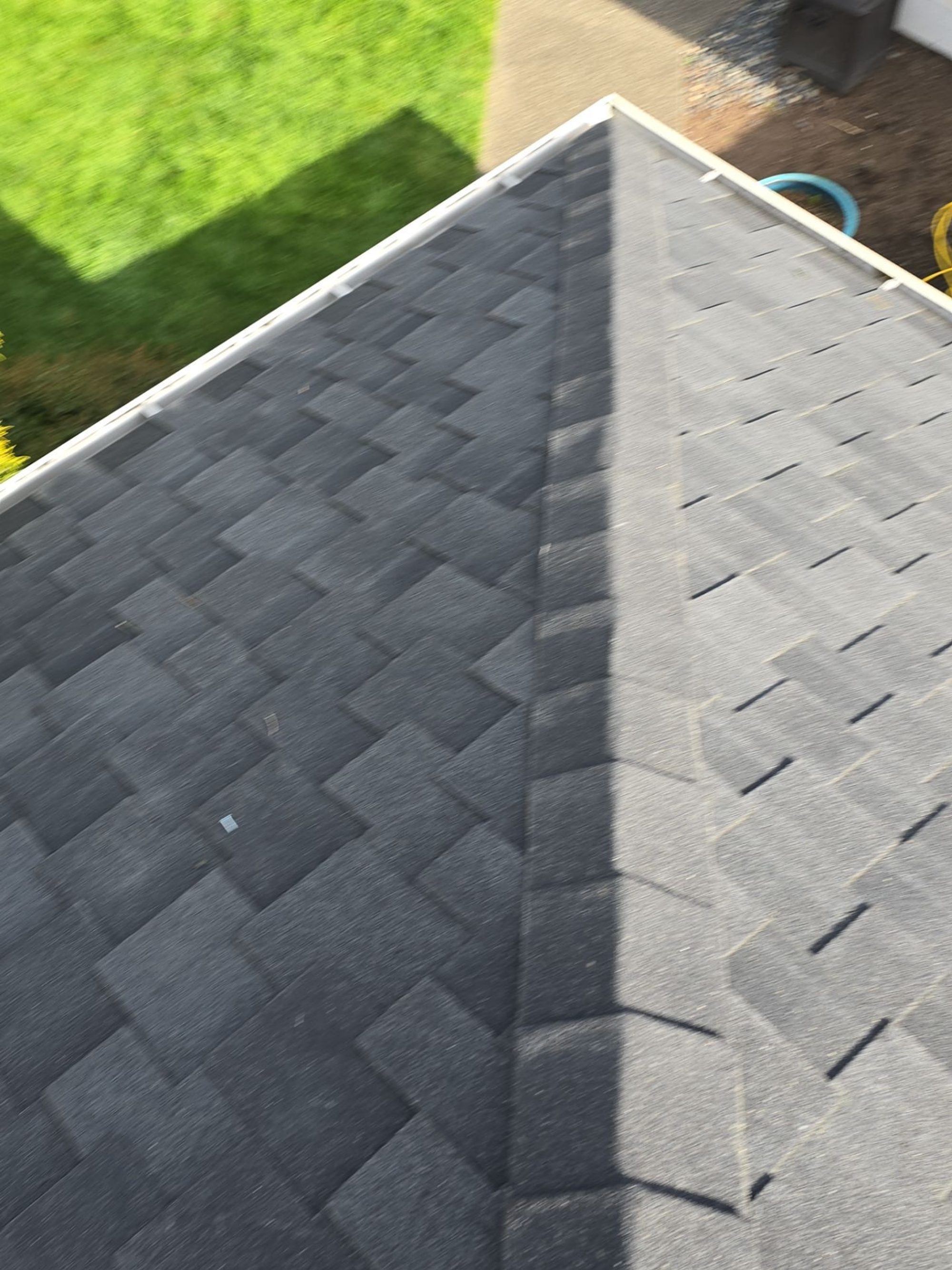 Ridge line of the Midnight Black designer shake roof looking down to the yard, Brier, WA