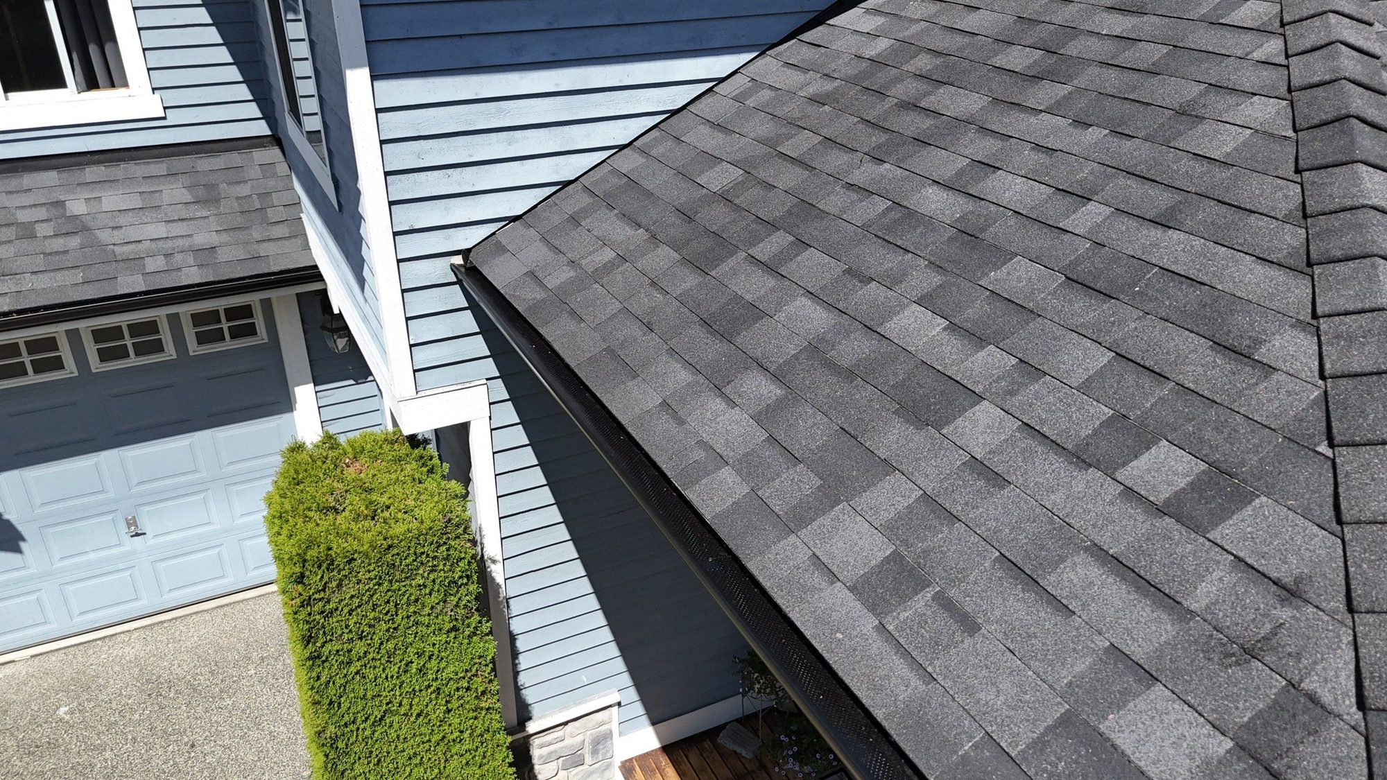 Drone view of the finished Malarkey Legacy Midnight Black asphalt shingle roof with new skylights, Lake Stevens, WA, by Amor Roofing