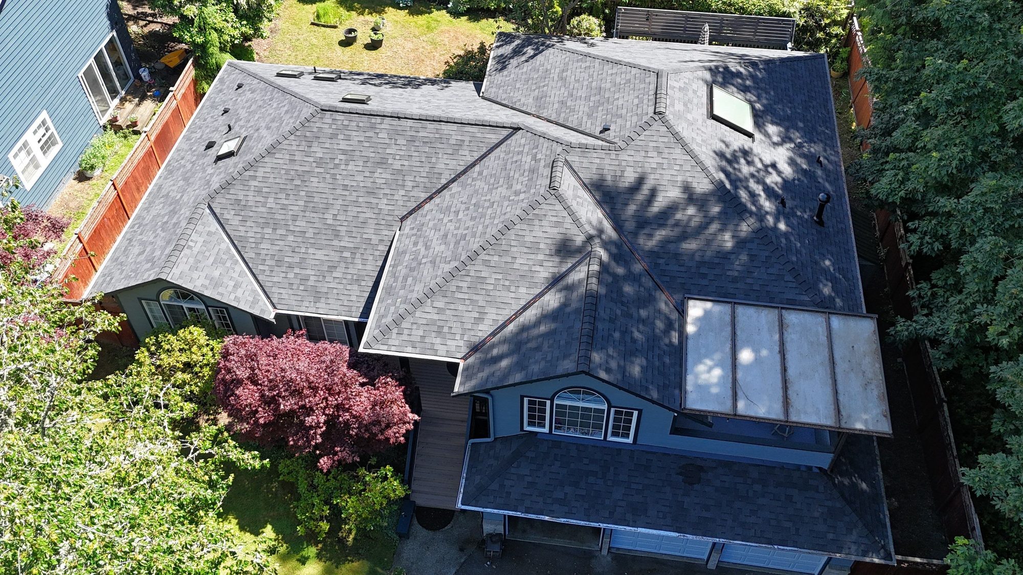 Aerial view of the Edmonds home with its new Midnight Black asphalt roof