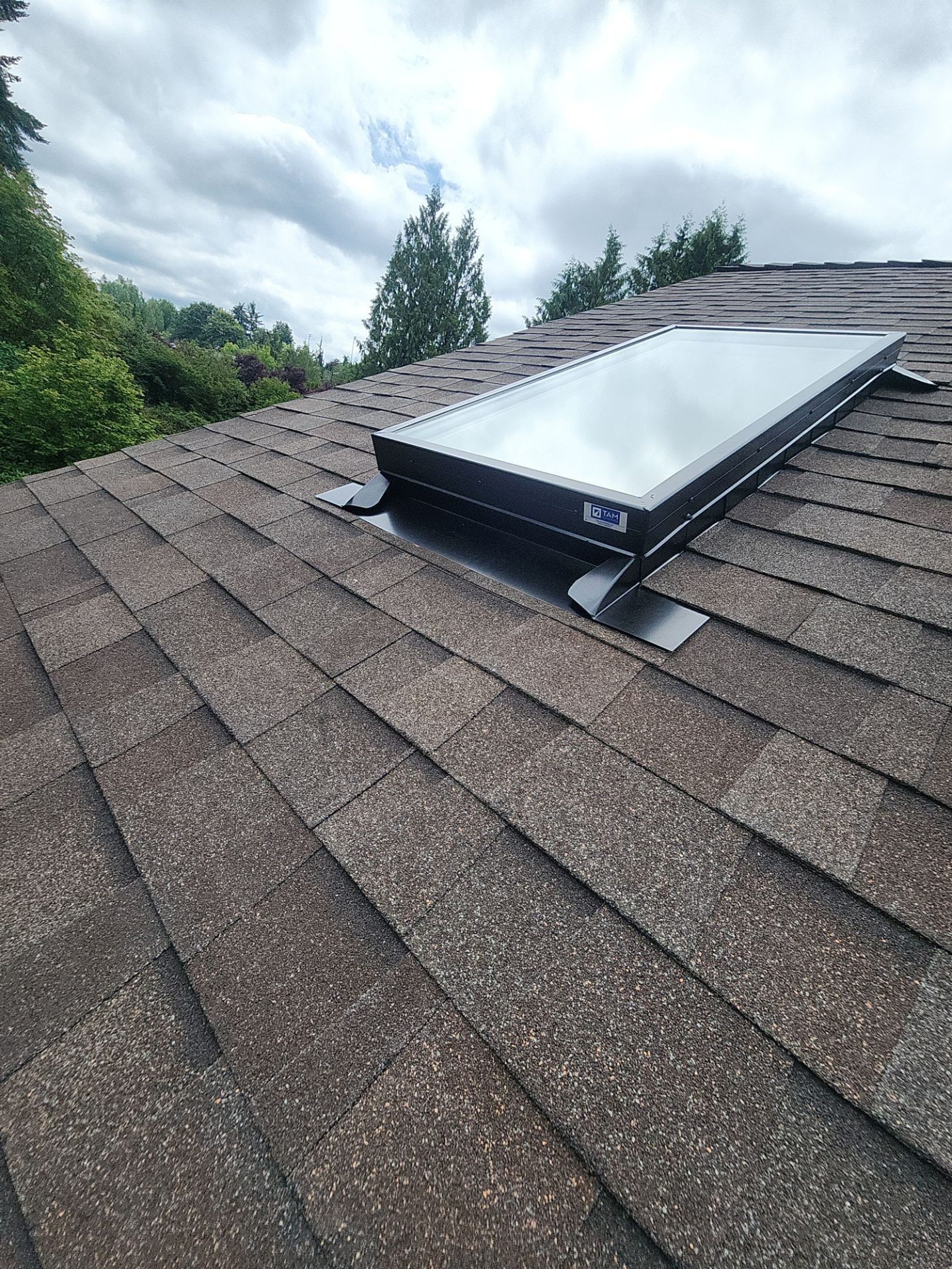 New skylight flashed into the Malarkey Heather Grey asphalt shingle roof, Lake Stevens, WA
