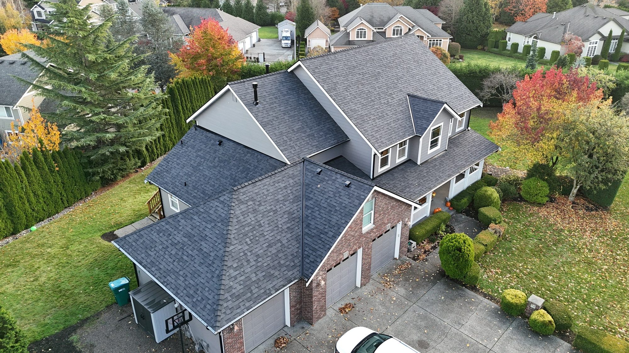 Aerial view of a finished asphalt shingle roof in Snohomish, WA, hero