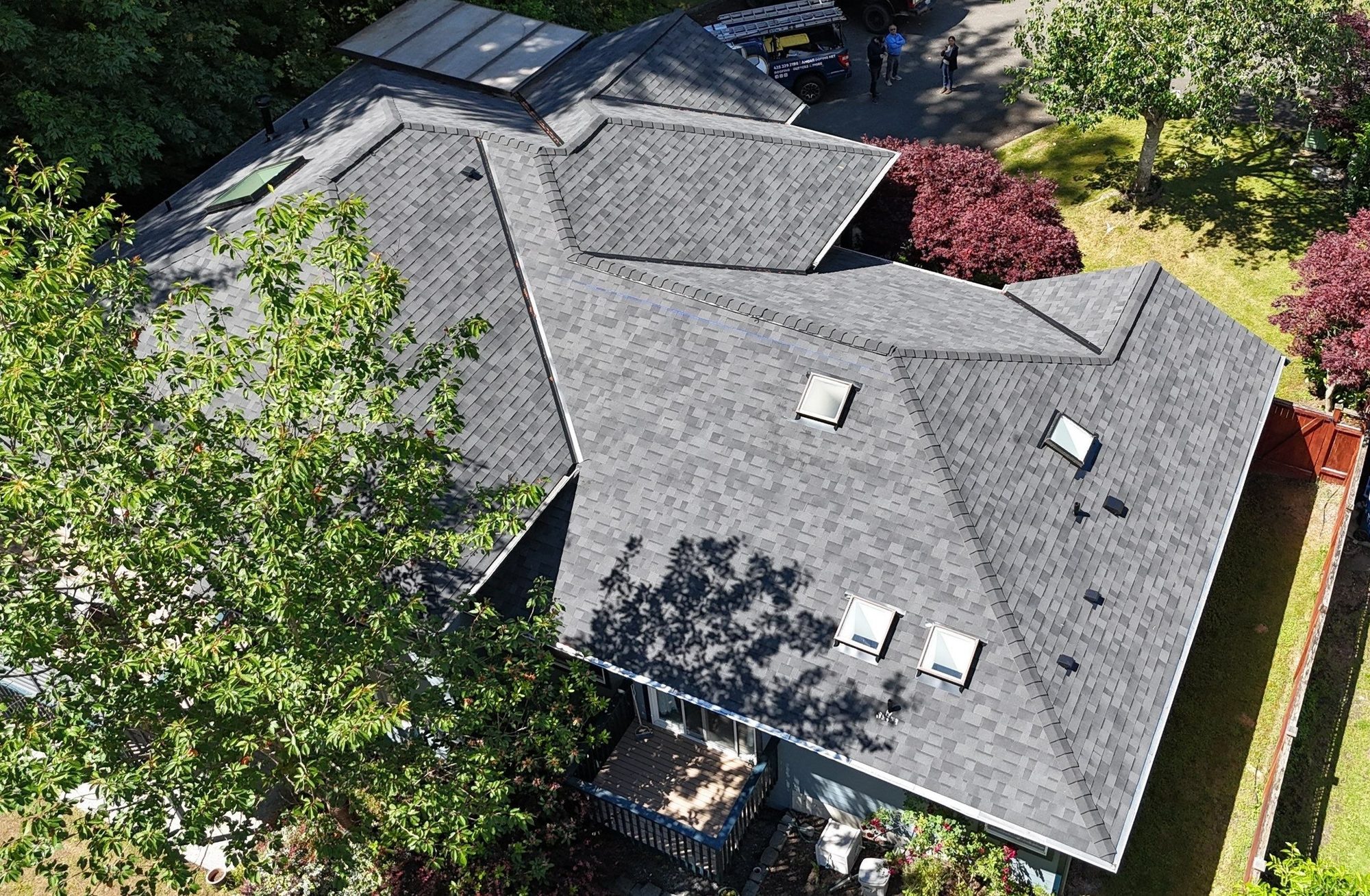 Rear aerial of the finished Malarkey Vista Midnight Black asphalt shingle roof over the deck, Edmonds, WA