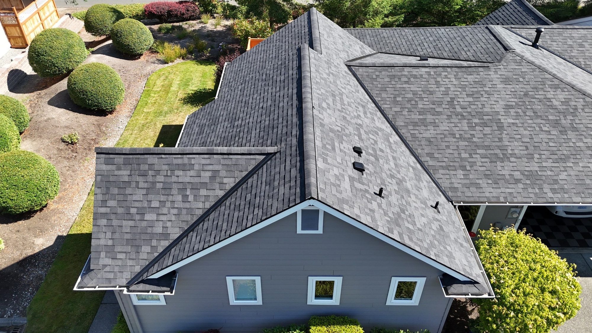 Aerial of the Malarkey Highlander Midnight Black asphalt shingle roof showing the hip and ridge lines, Redmond, WA