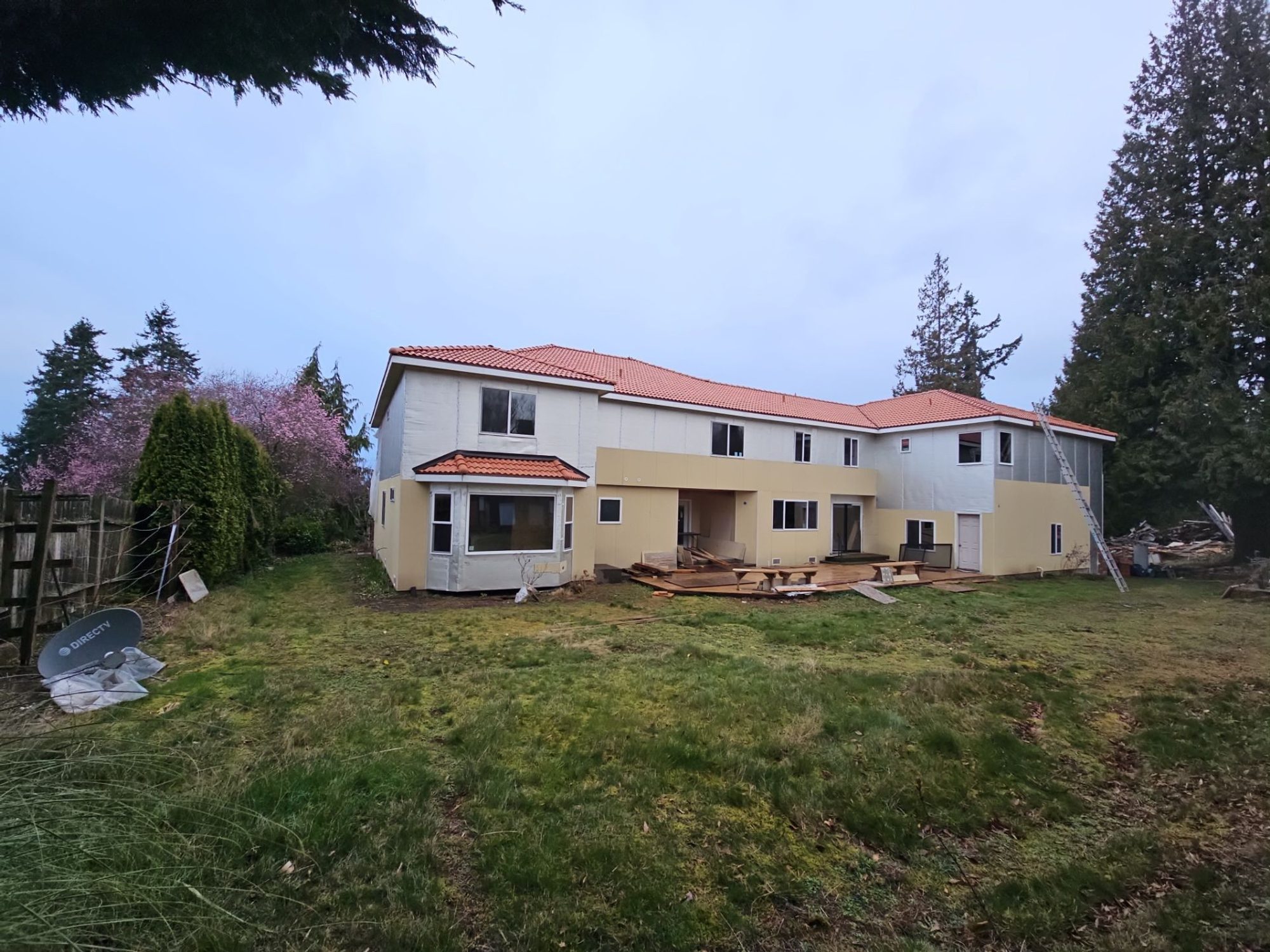 Full view of the Mukilteo, WA home and its new Antique Clay Brava composite Spanish barrel tile roof from the back yard