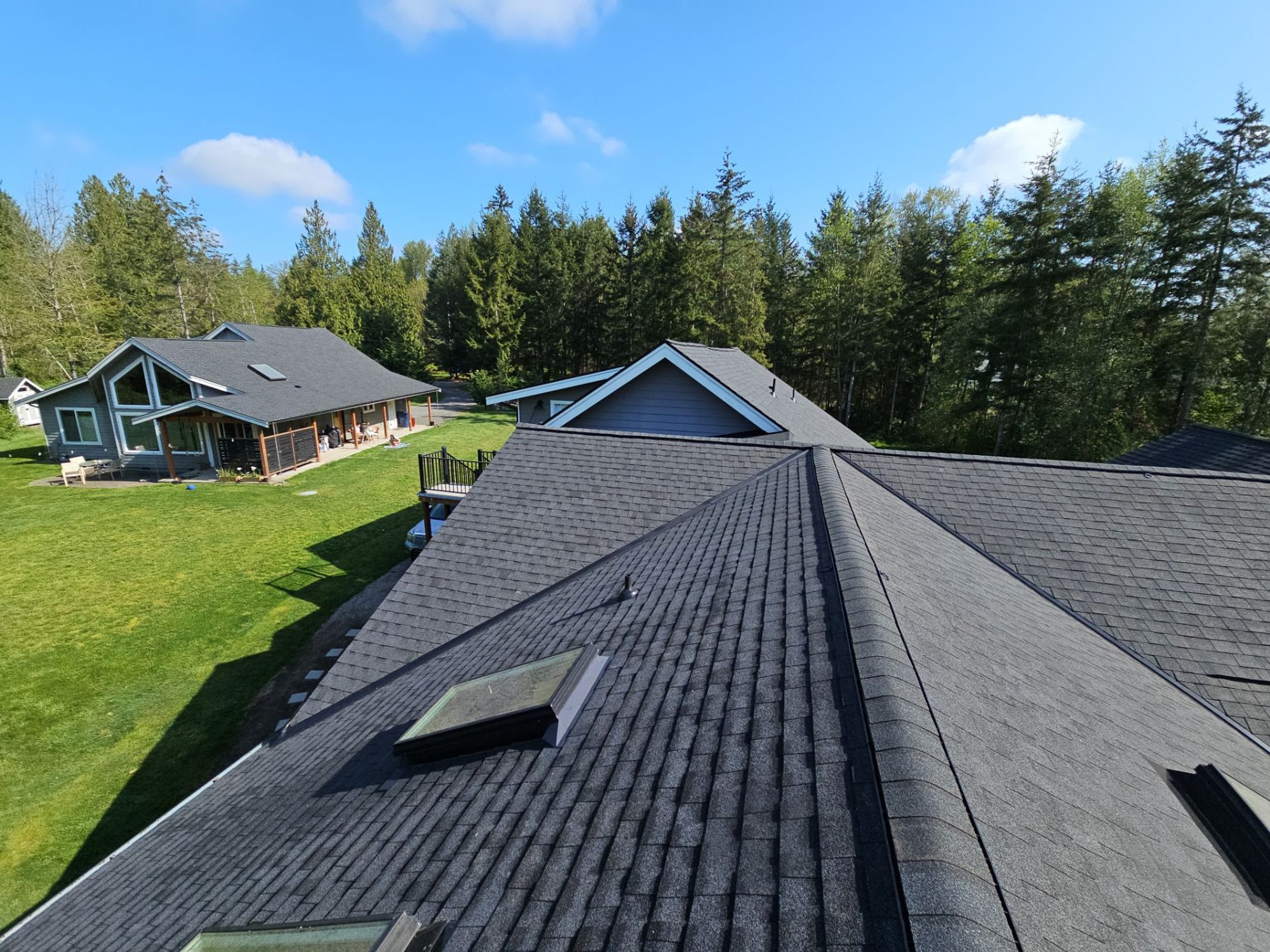 Ridge-level view of the new Antique Black shingles and skylight, Lake Stevens, WA