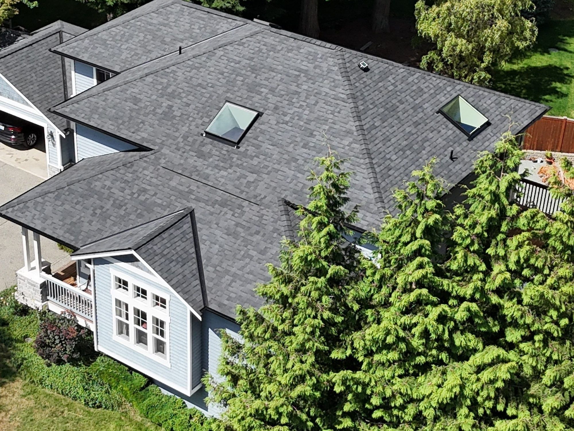 Drone view of the finished Malarkey Legacy Midnight Black asphalt shingle roof with new skylights, Lake Stevens, WA, by Amor Roofing
