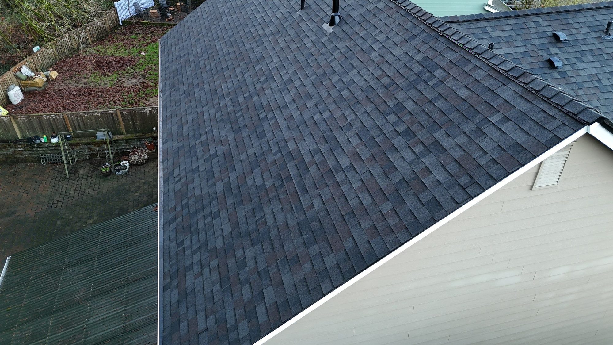 Aerial over the finished Malarkey Vista Black Oak asphalt shingle roof and side dormer, Snohomish, WA