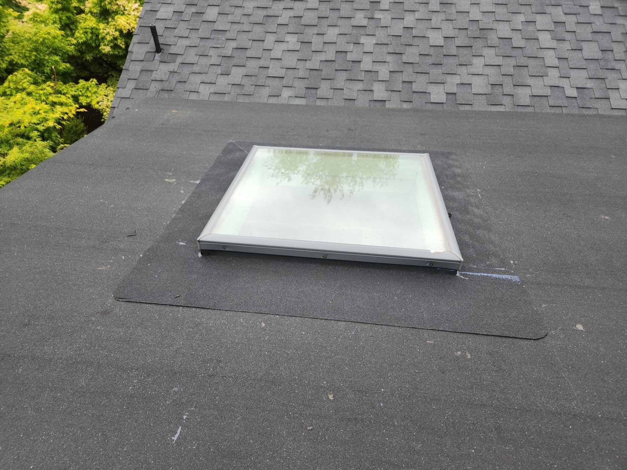 Skylight and shingle field on the finished Midnight Black designer shake roof, Brier, WA