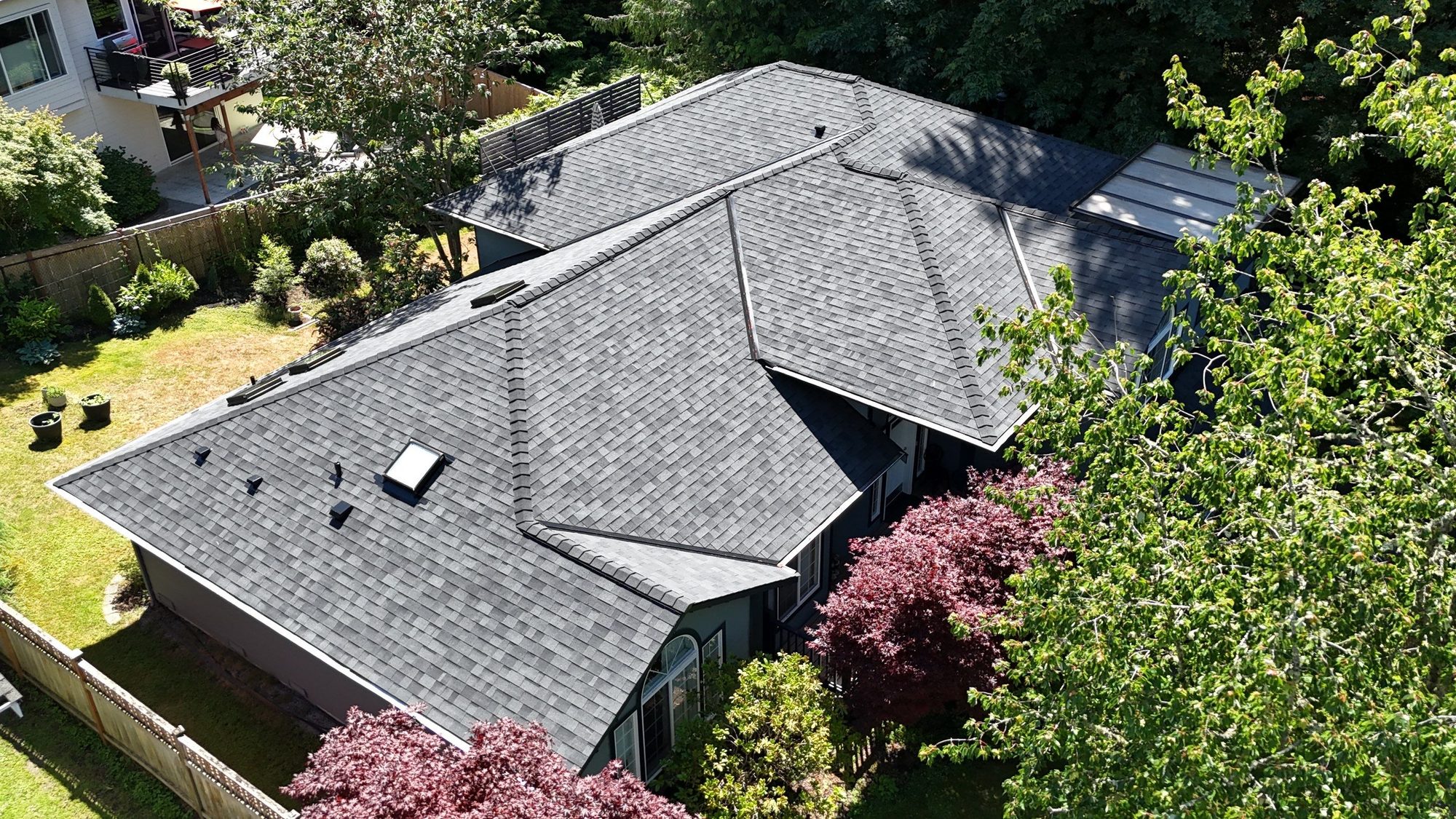 Overhead drone view of the finished Midnight Black asphalt roof in Edmonds