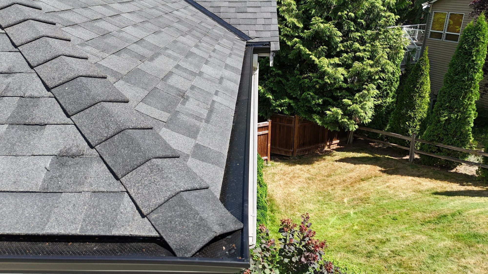 Drone view of the finished Malarkey Legacy Midnight Black asphalt shingle roof with new skylights, Lake Stevens, WA, by Amor Roofing