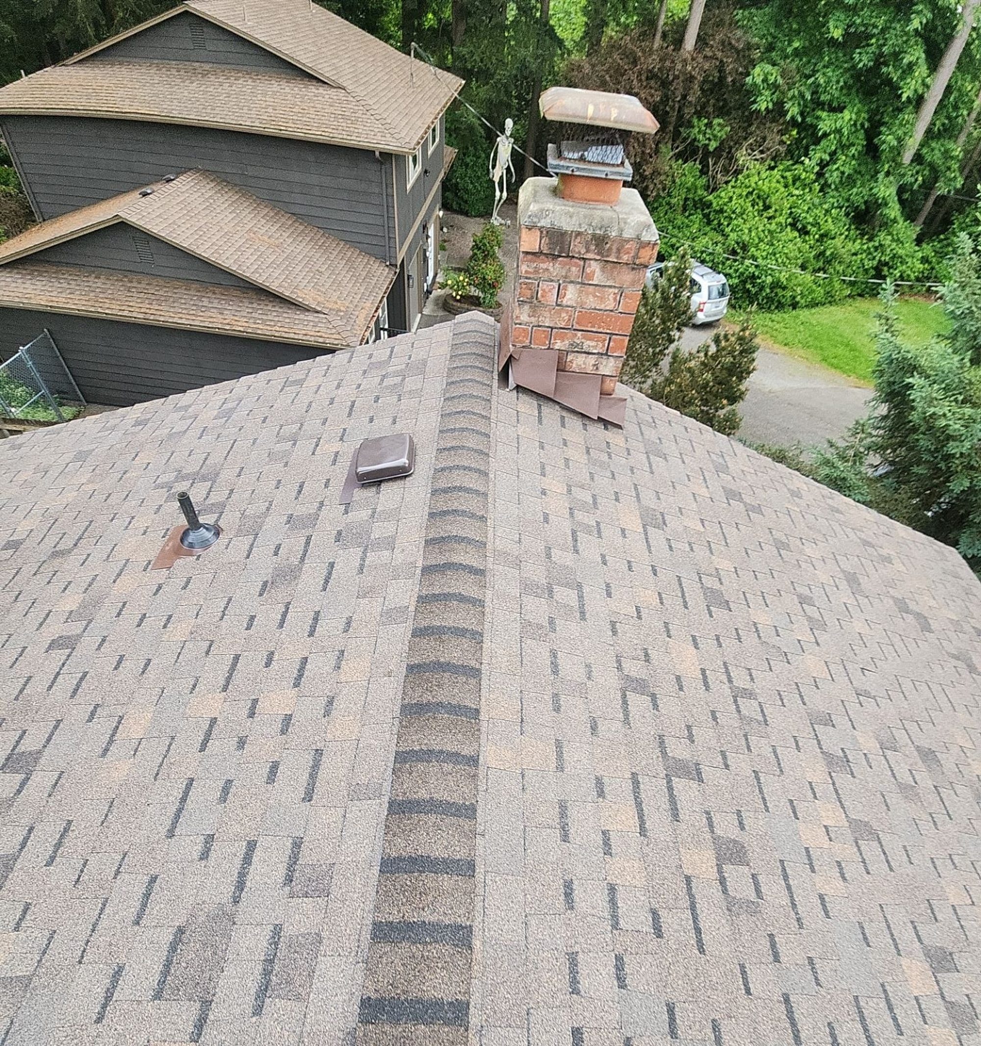 Ridge and chimney flashing on the Pabco Oakwood asphalt shingle roof, Lynnwood, WA