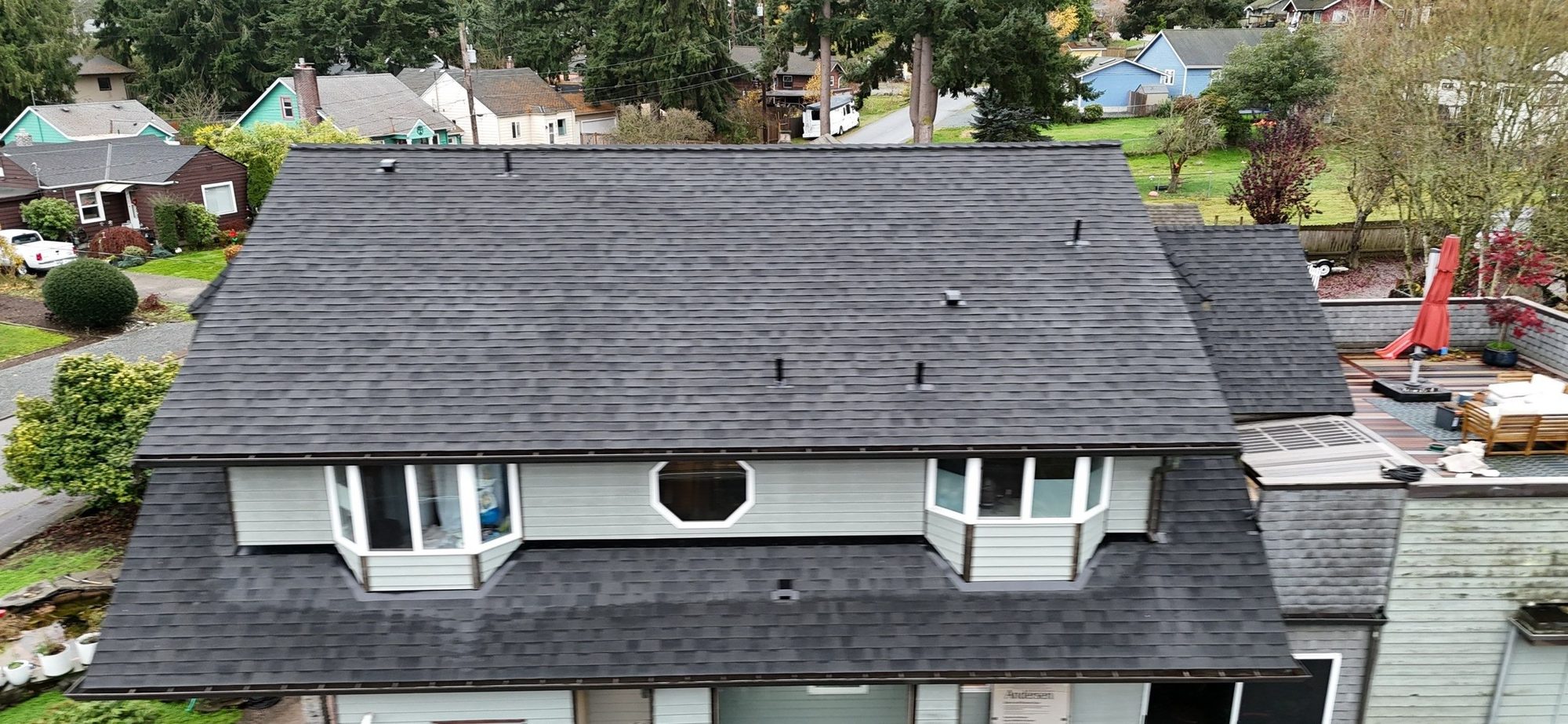 Drone view of the finished Malarkey Midnight Black asphalt shingle roof, Everett, WA, by Amor Roofing