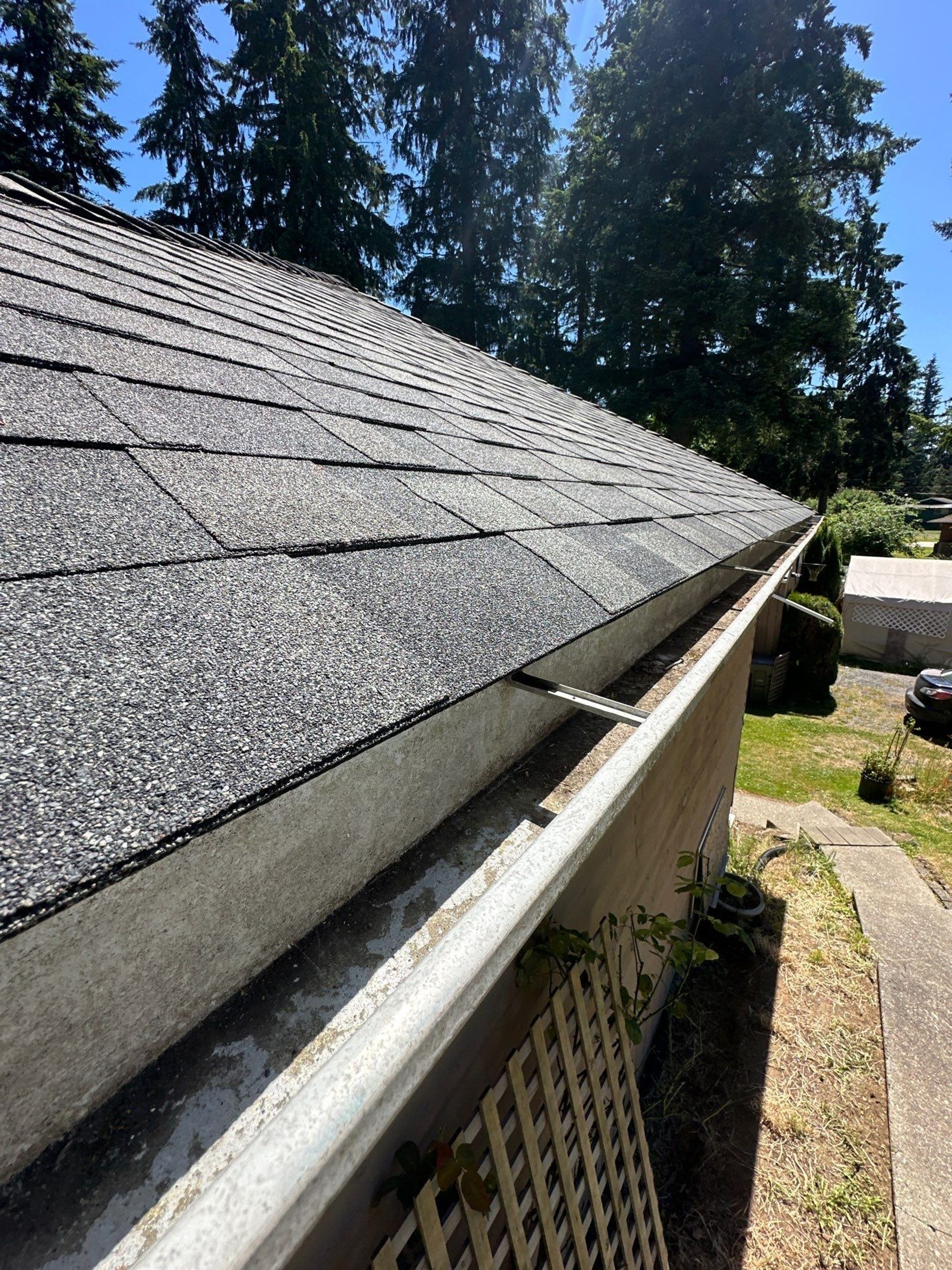 Eave and ridge line of the Malarkey Storm Grey asphalt shingle roof toward the street, Lake Stevens, WA