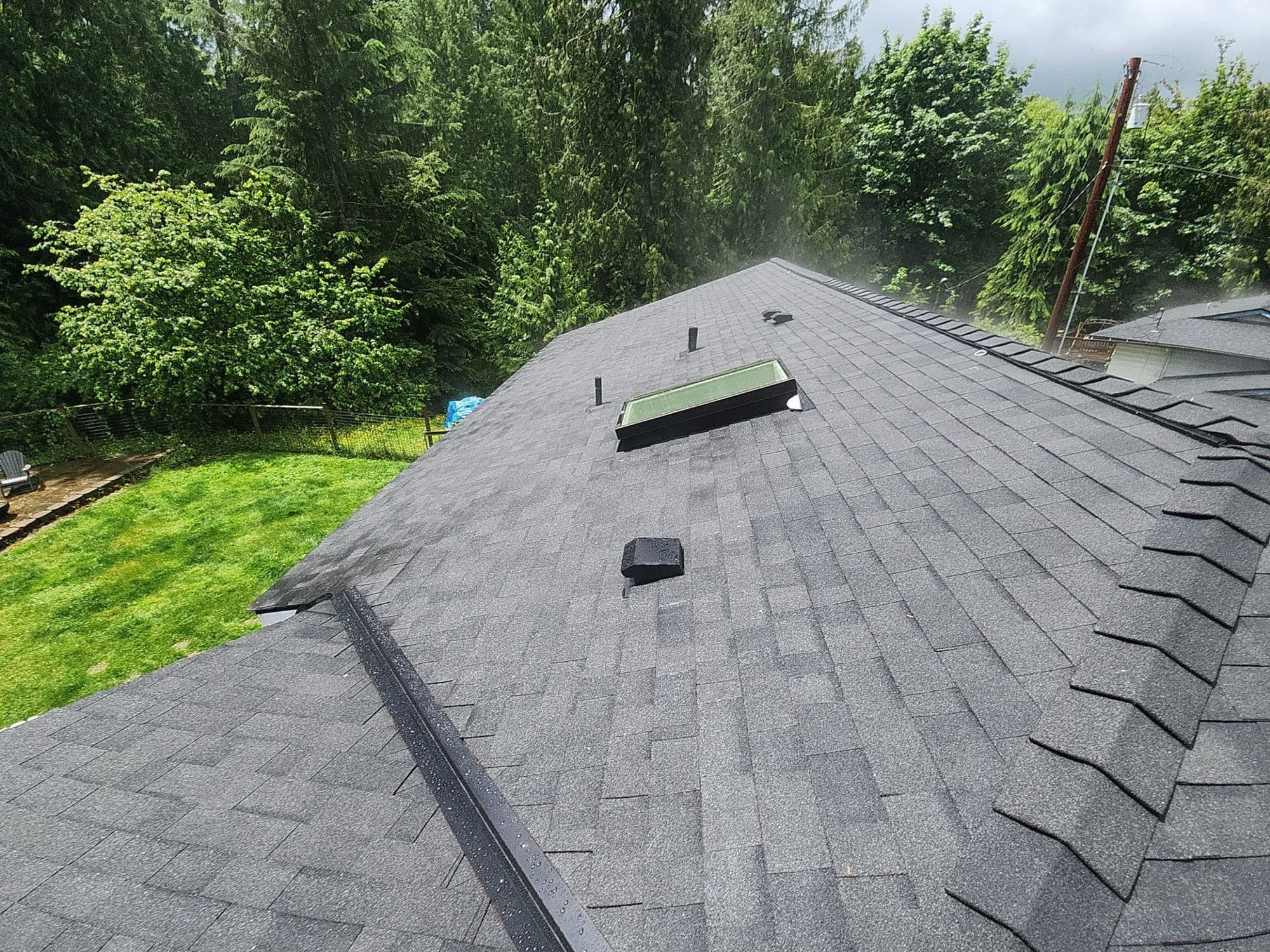 Finished Malarkey Legacy Midnight Black asphalt shingle roof with ridge vent and skylights, Lake Stevens, WA
