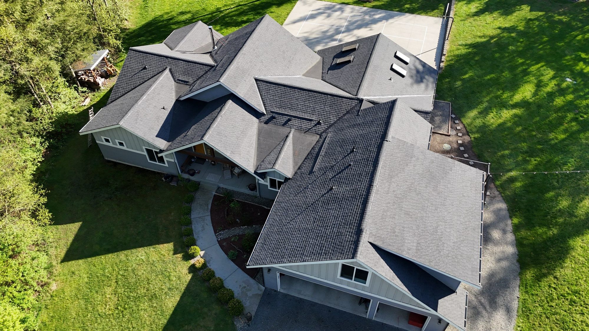 High aerial of the finished Antique Black asphalt roof and multi-gable roofline, Lake Stevens, WA