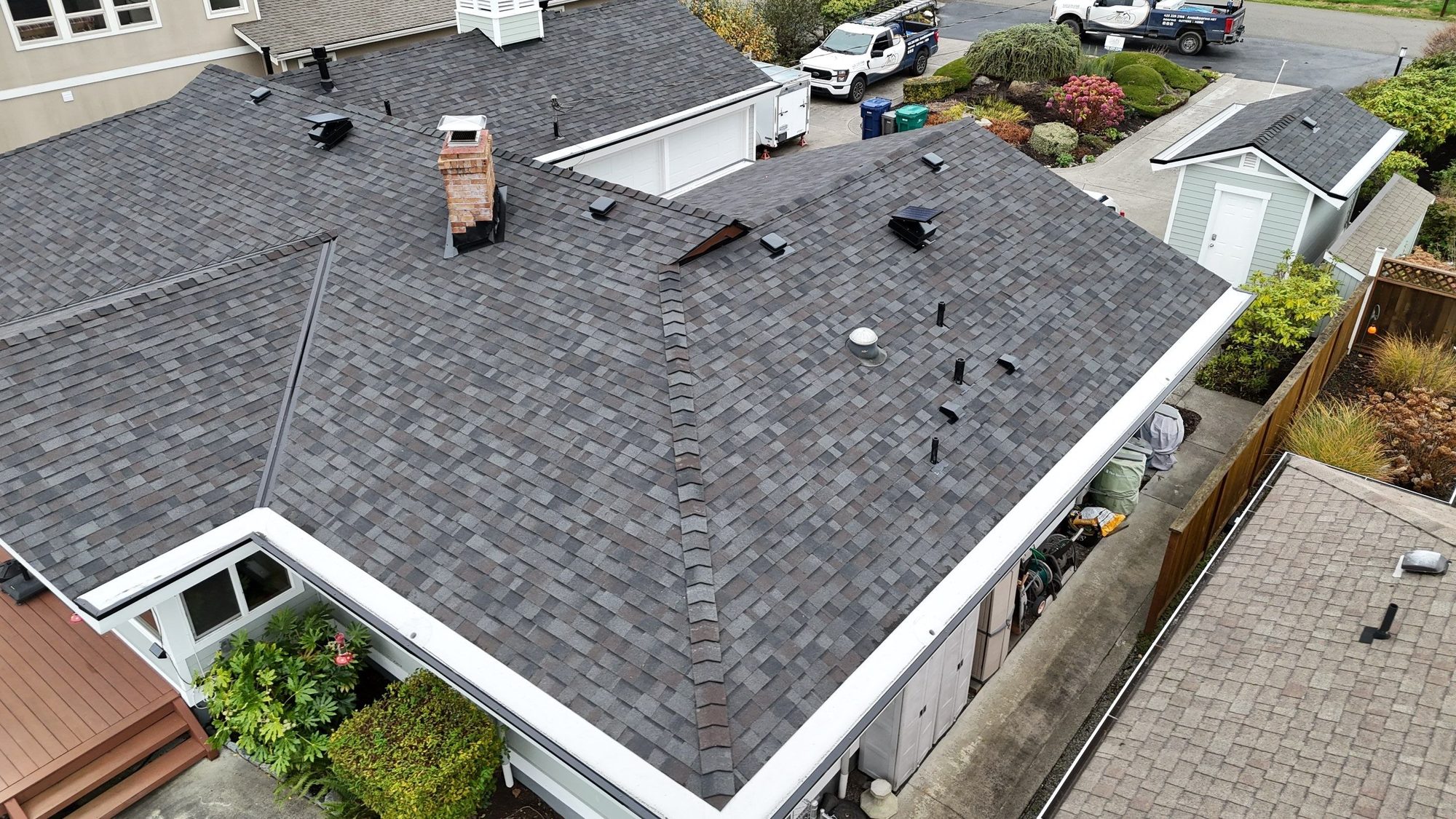 Amor Roofing Black Oak asphalt roof in Camano Island, drone hip roof planes