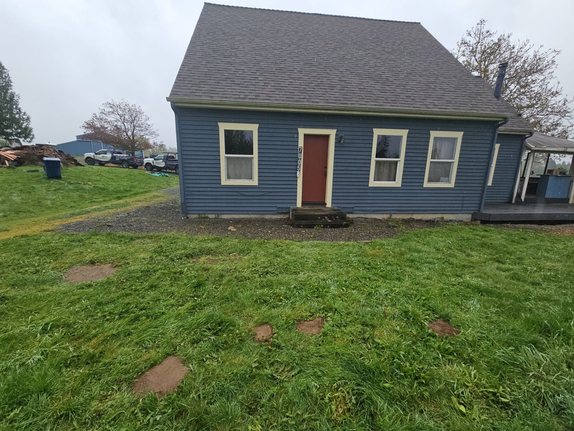 The detached garage with its new matching asphalt roof, part of the two-building Snohomish project