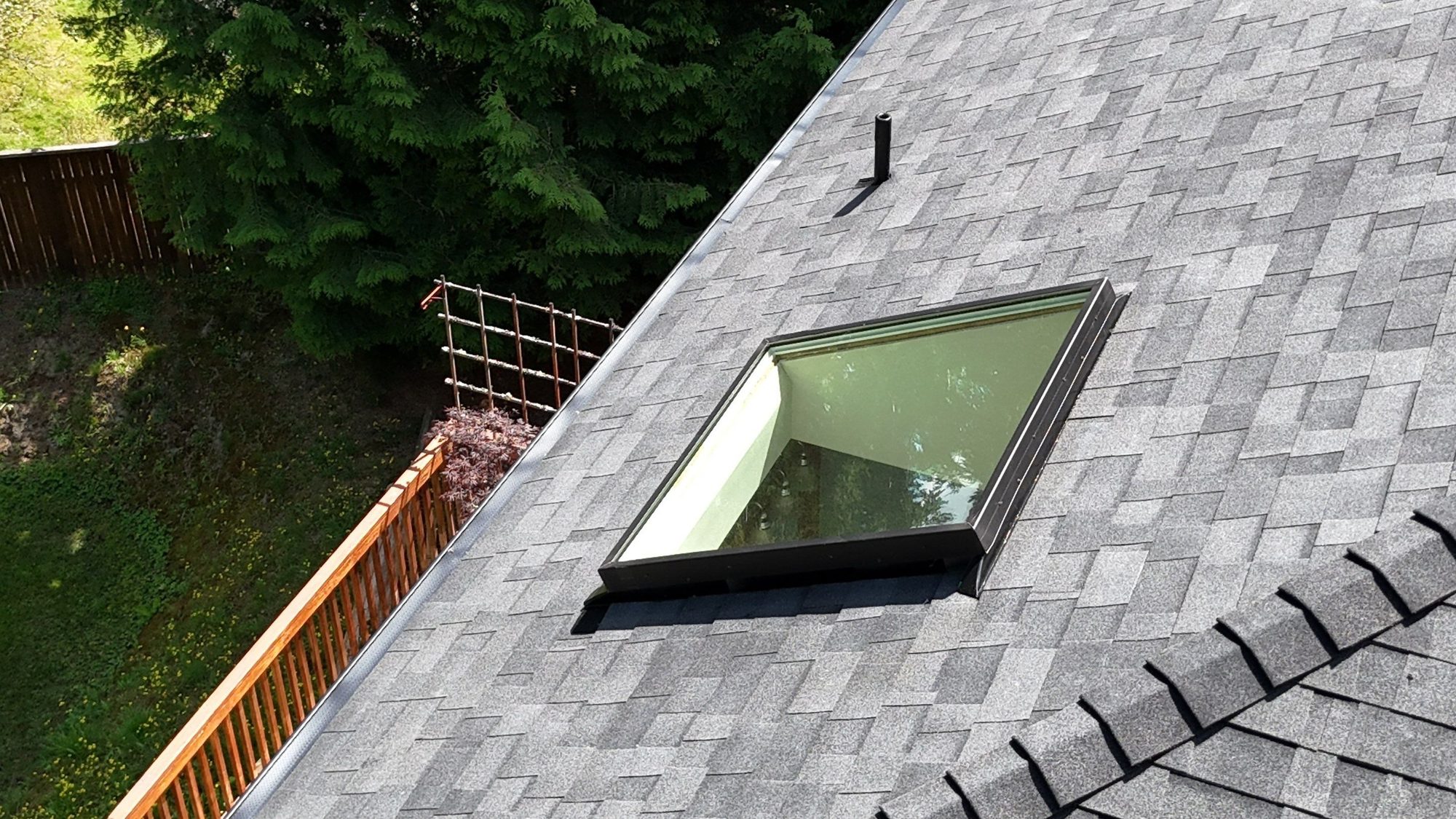 Drone view of the finished Malarkey Legacy Midnight Black asphalt shingle roof with new skylights, Lake Stevens, WA, by Amor Roofing