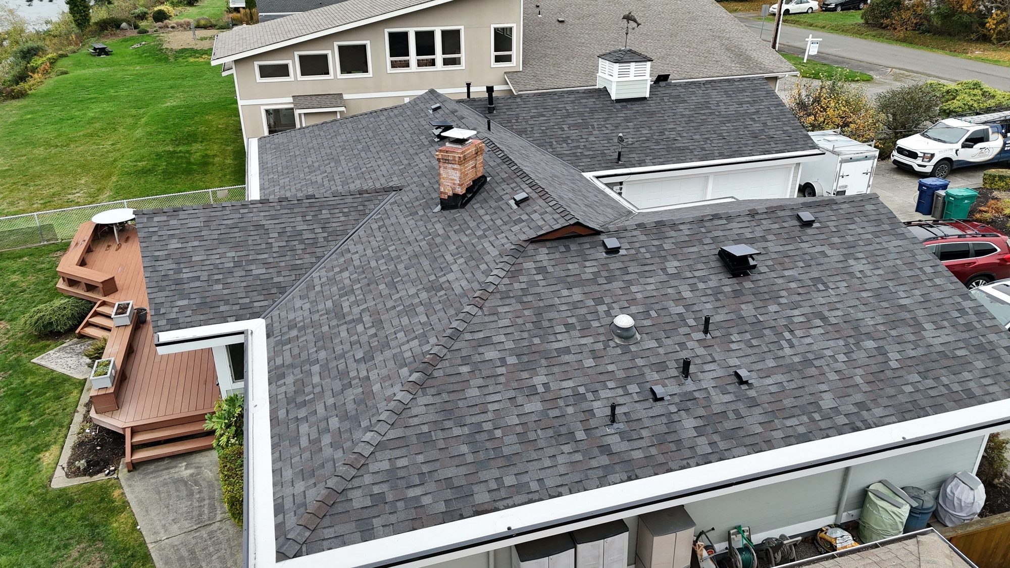 Amor Roofing Black Oak asphalt roof in Camano Island, drone roof valley chimney