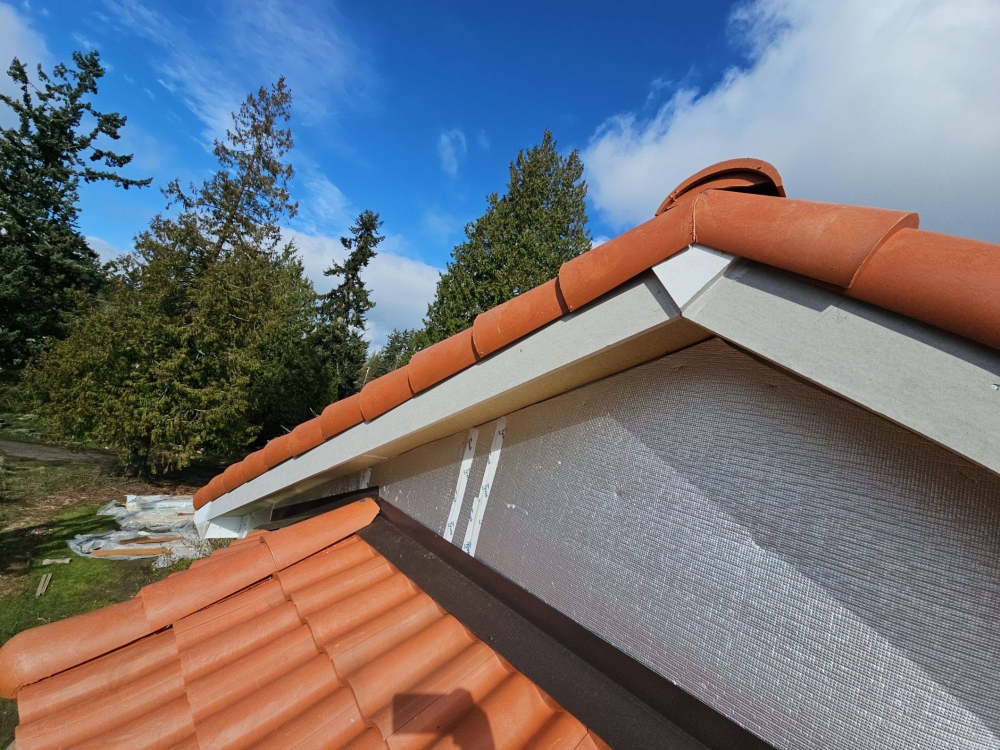 Rake edge and ridge cap detail on the Antique Clay Brava composite Spanish barrel tile roof, Mukilteo, WA