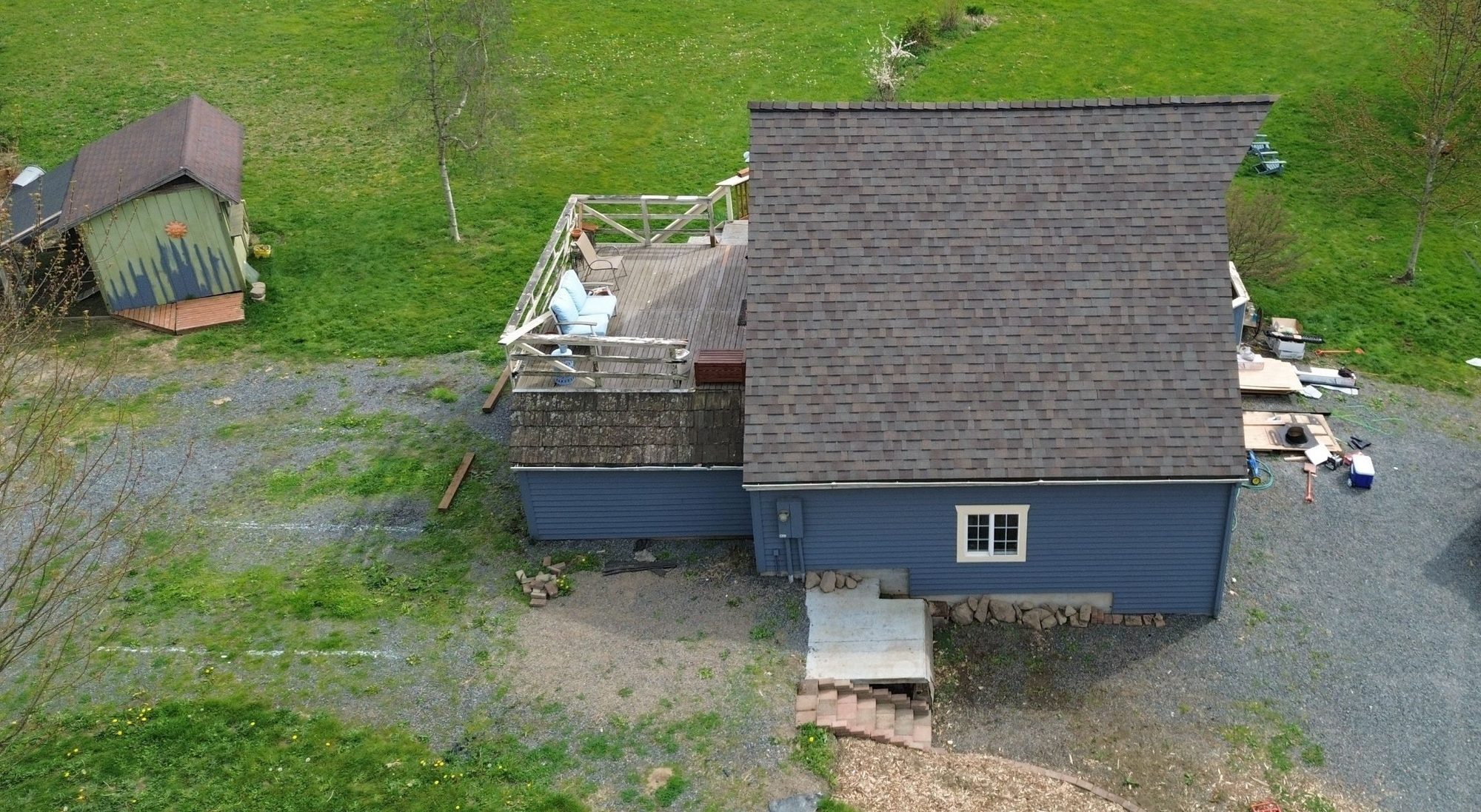 Aerial of the garage's completed Malarkey Vista Natural Wood asphalt shingle roof beside the main house, Snohomish, WA