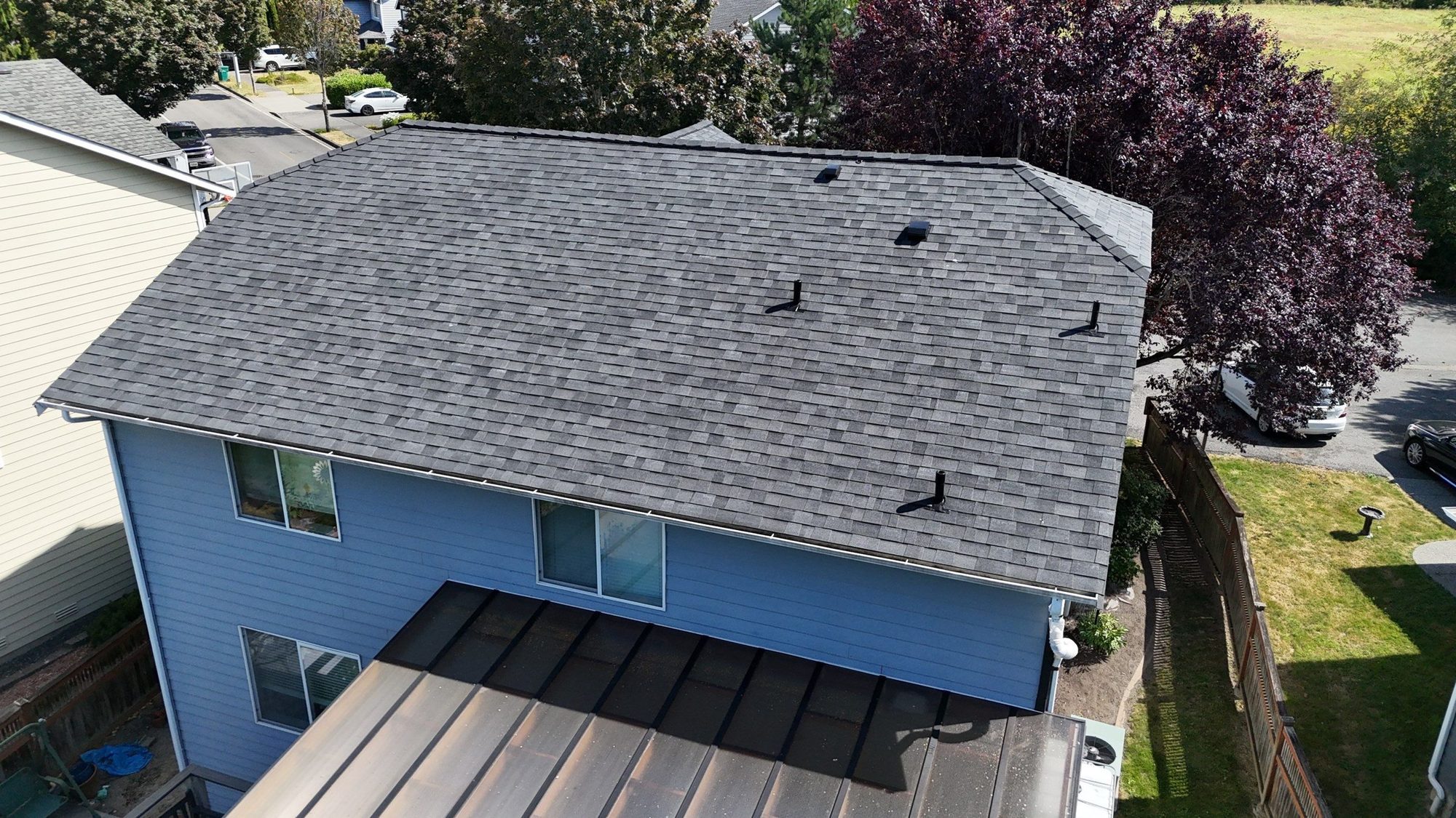 Drone view of the finished Malarkey Midnight Black asphalt shingle roof, Marysville, WA, by Amor Roofing