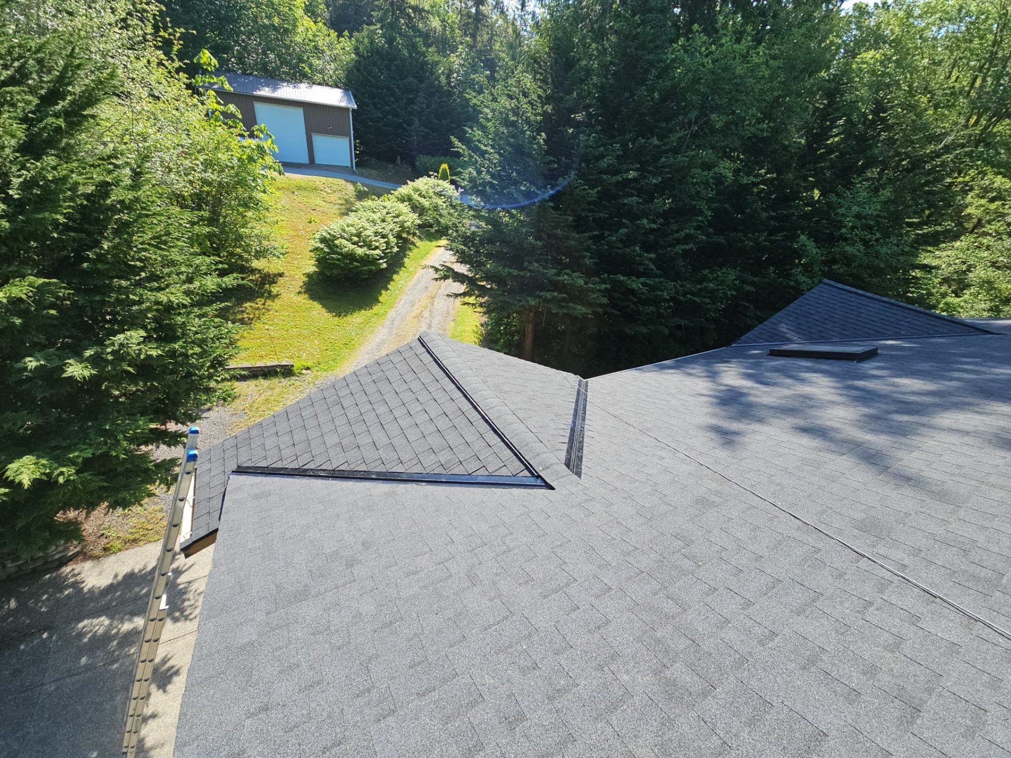 Valleys of the finished Antique Black asphalt shingle roof over the garden, Tulalip Bay, WA