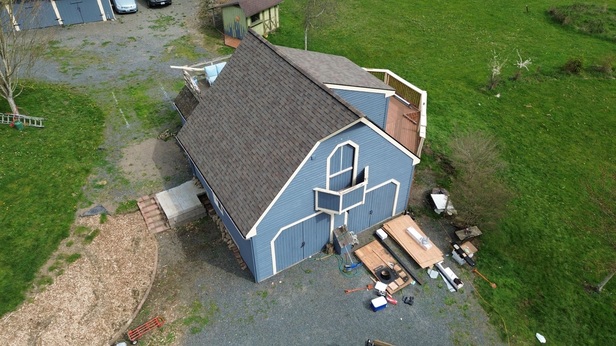 Drone view of the detached garage with its finished Malarkey Vista Natural Wood roof, Snohomish, WA, by Amor Roofing