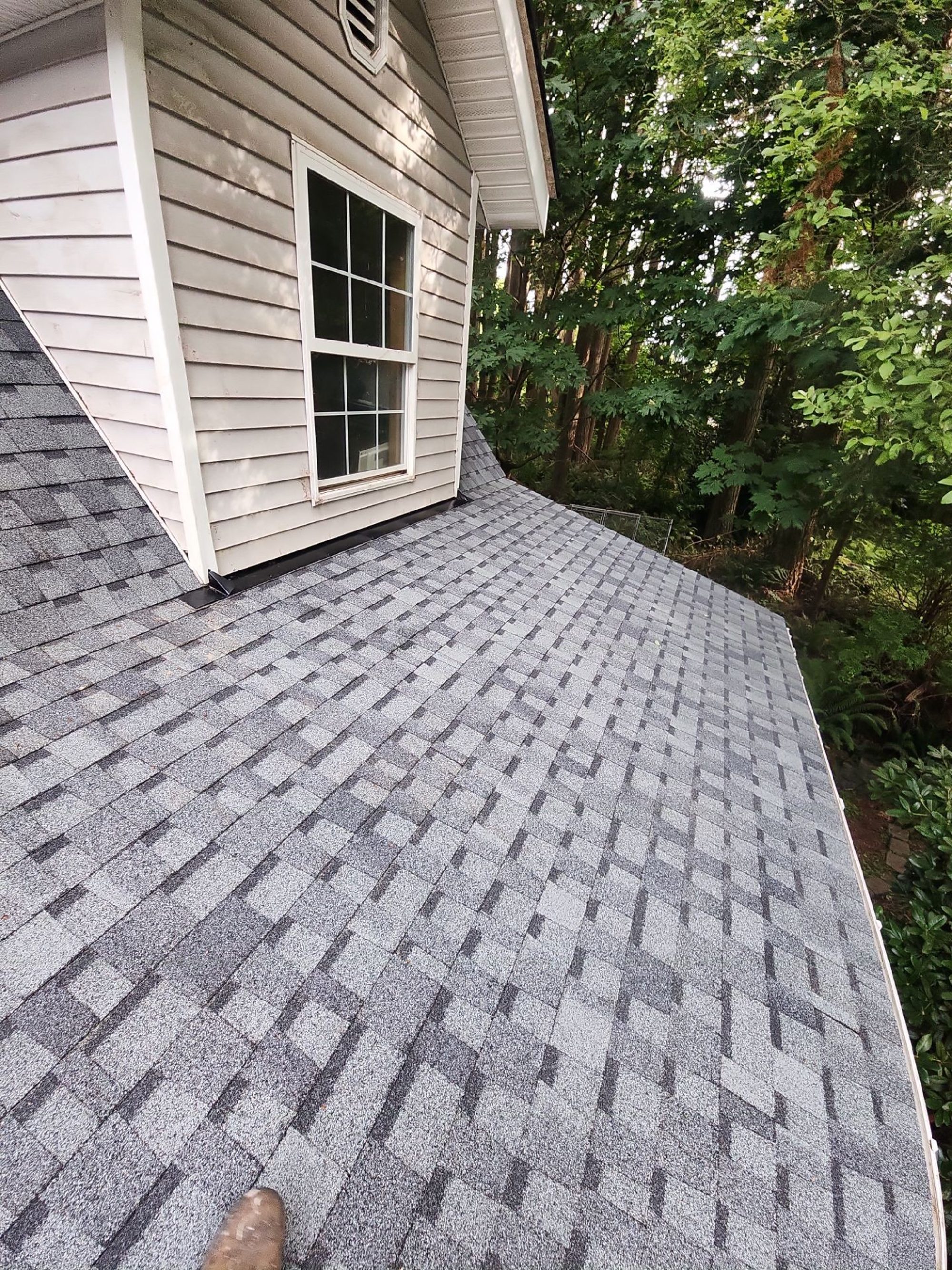 Dormer and finished Pabco Premier Pewter Gray asphalt shingle roof into the forest, Lake Stevens, WA