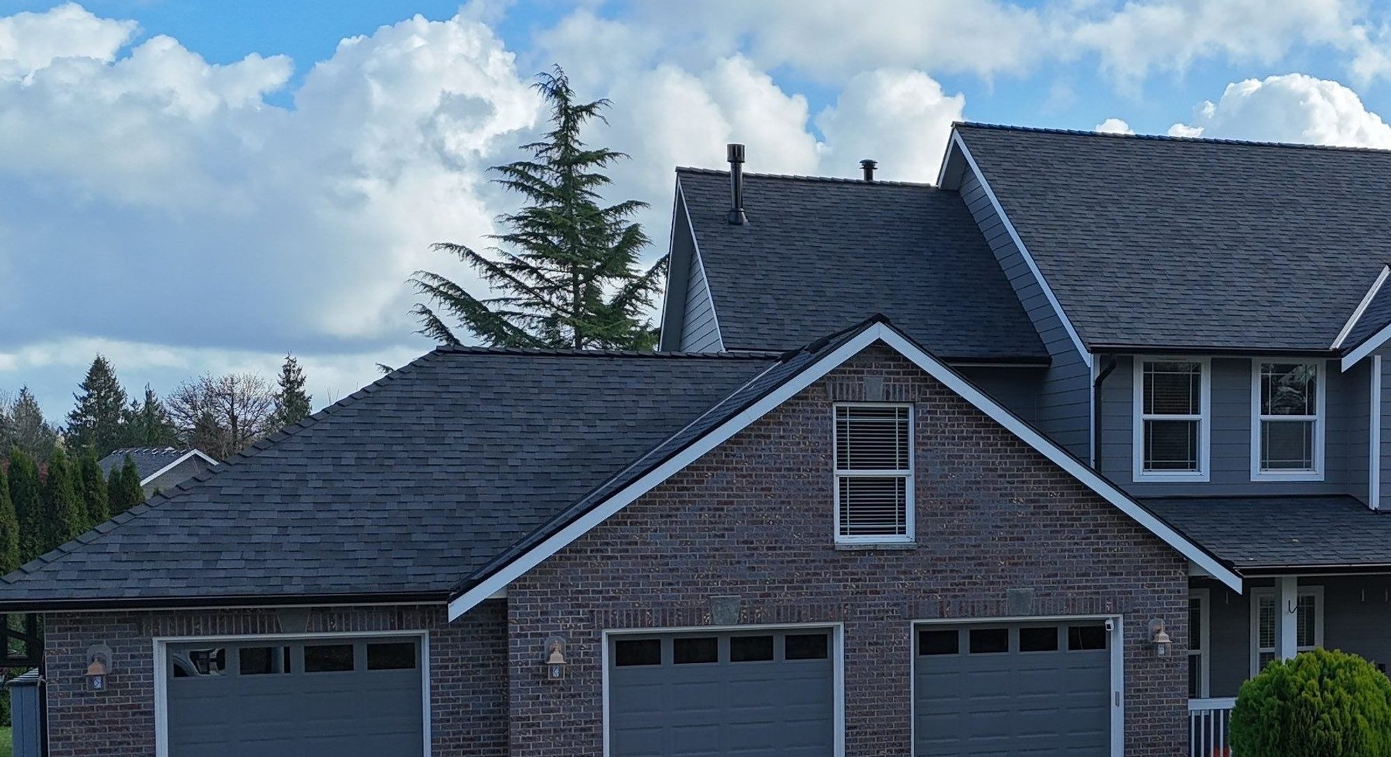 Amor Roofing Midnight Black asphalt roof in Snohomish, drone front midnight black