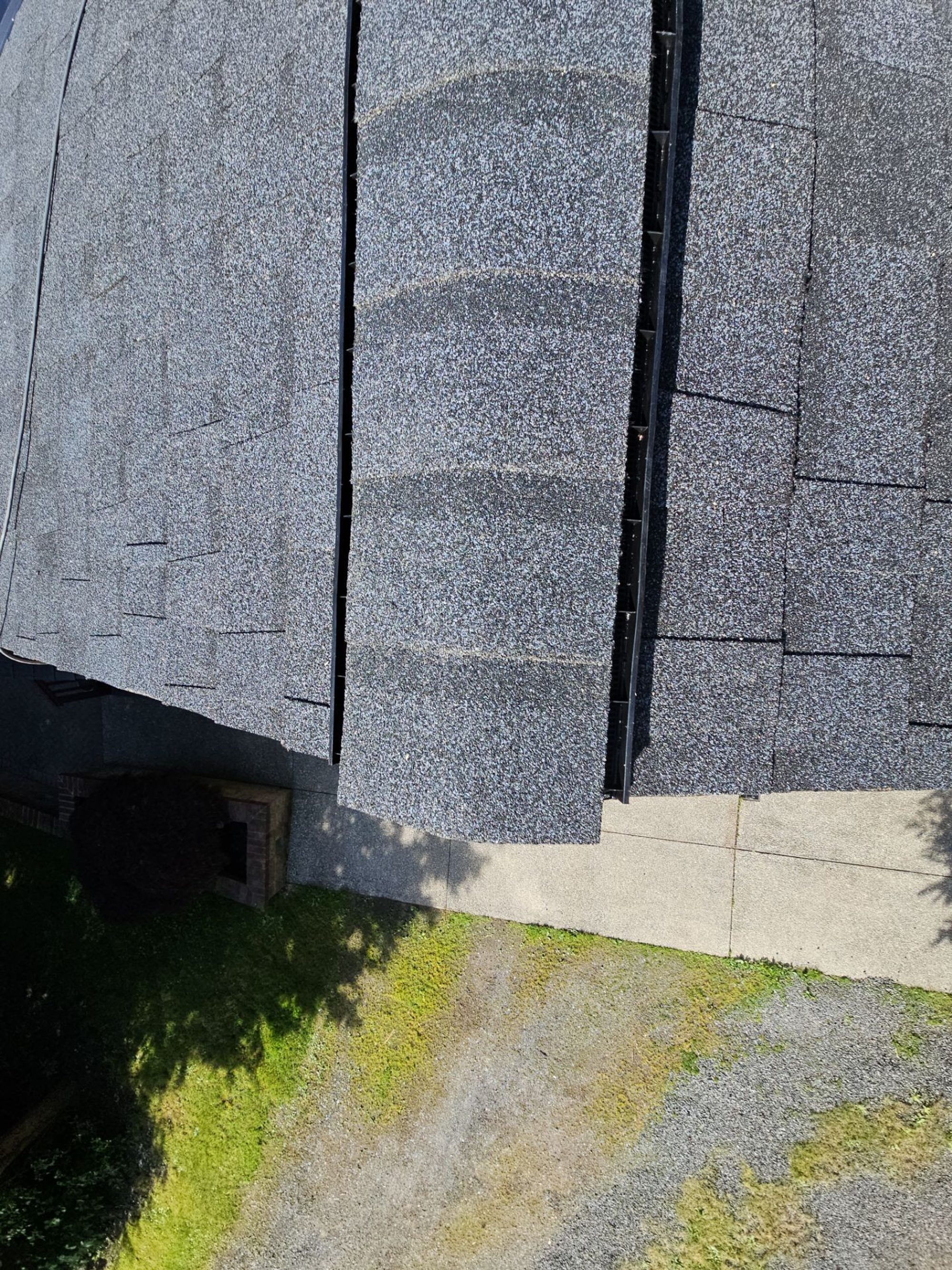 Skylight and ridge cap on the finished Antique Black asphalt shingle roof, Tulalip Bay, WA