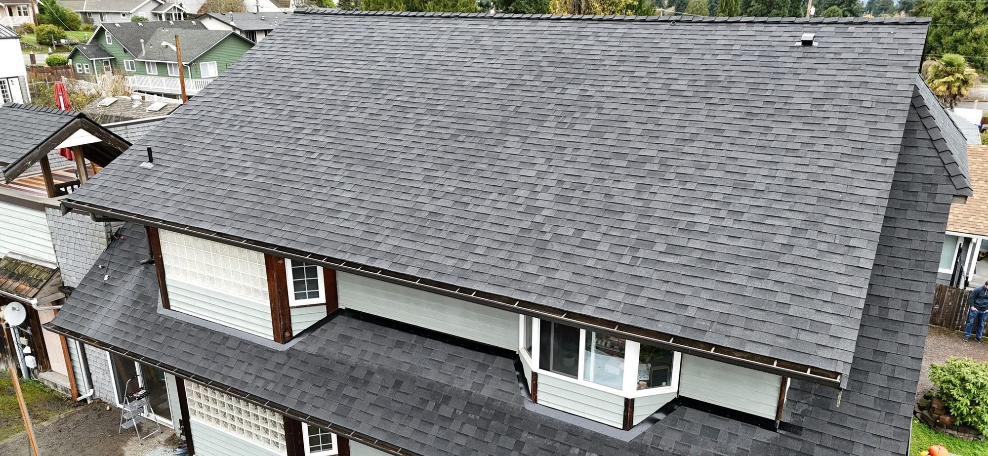 Drone view of the finished Malarkey Midnight Black asphalt shingle roof, Everett, WA, by Amor Roofing