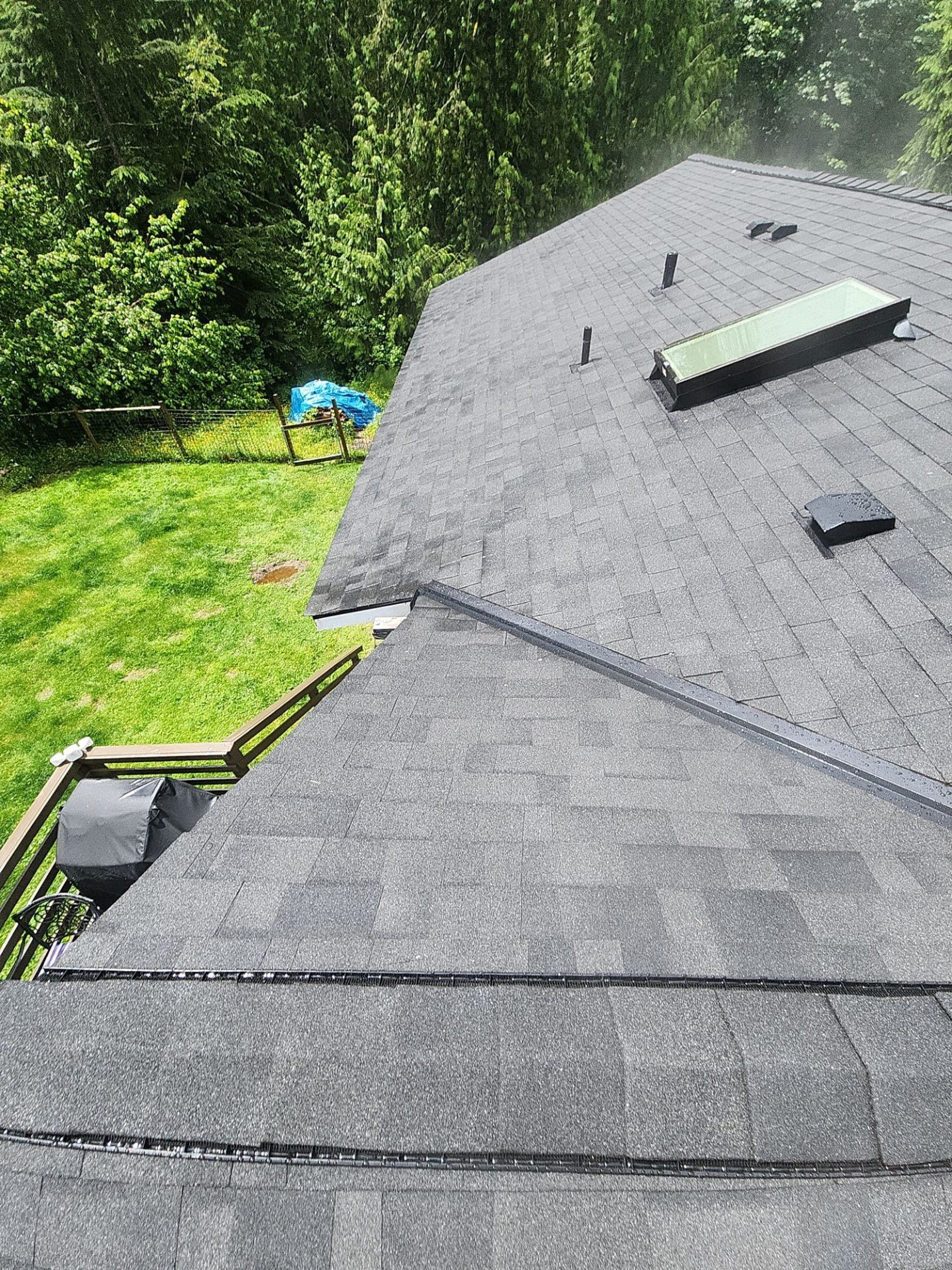 Finished Malarkey Legacy Midnight Black asphalt shingle roof with ridge vent and skylights, Lake Stevens, WA