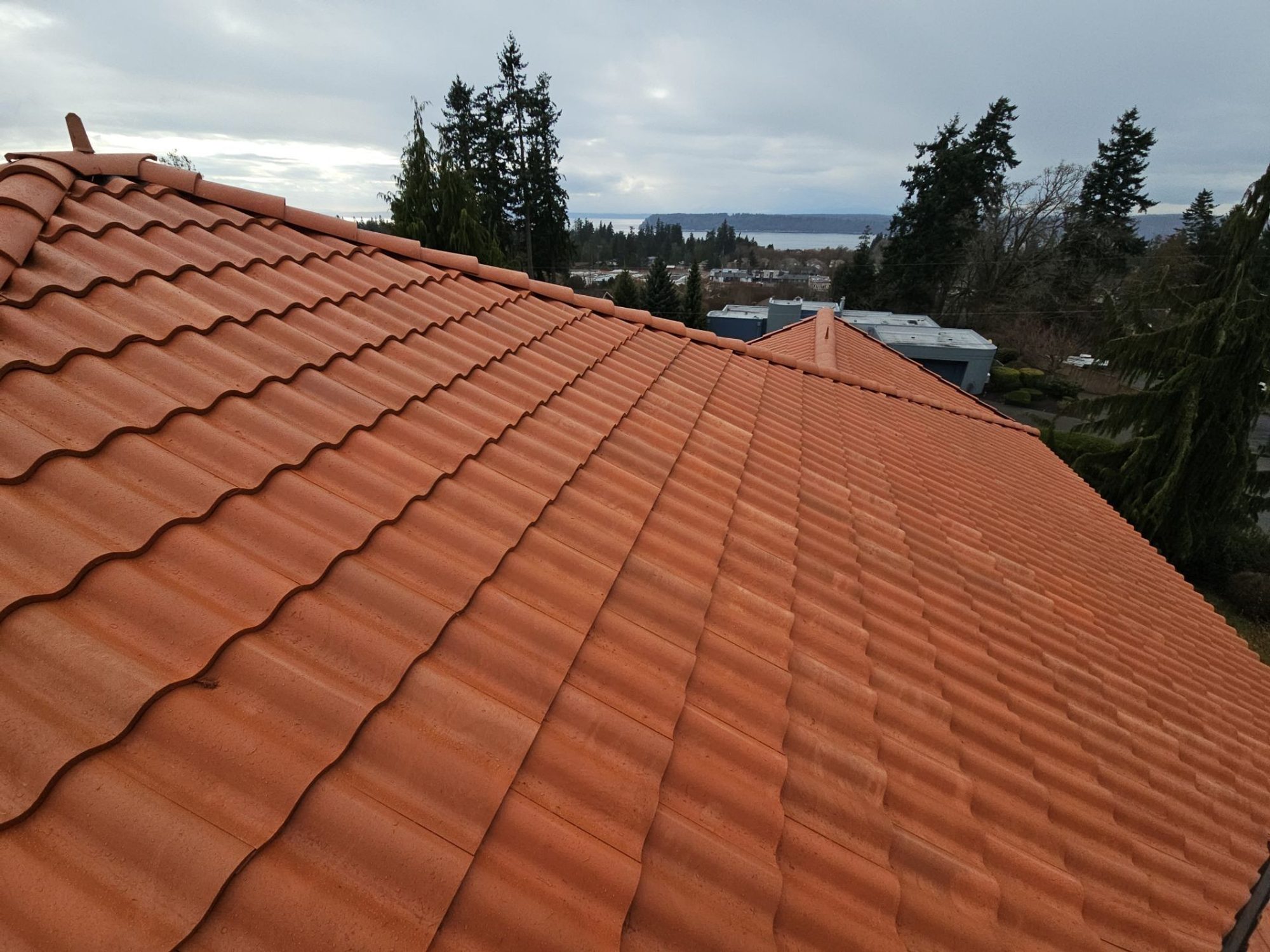 Eave of the Antique Clay Brava composite Spanish barrel tile roof looking out over Mukilteo, Mukilteo, WA