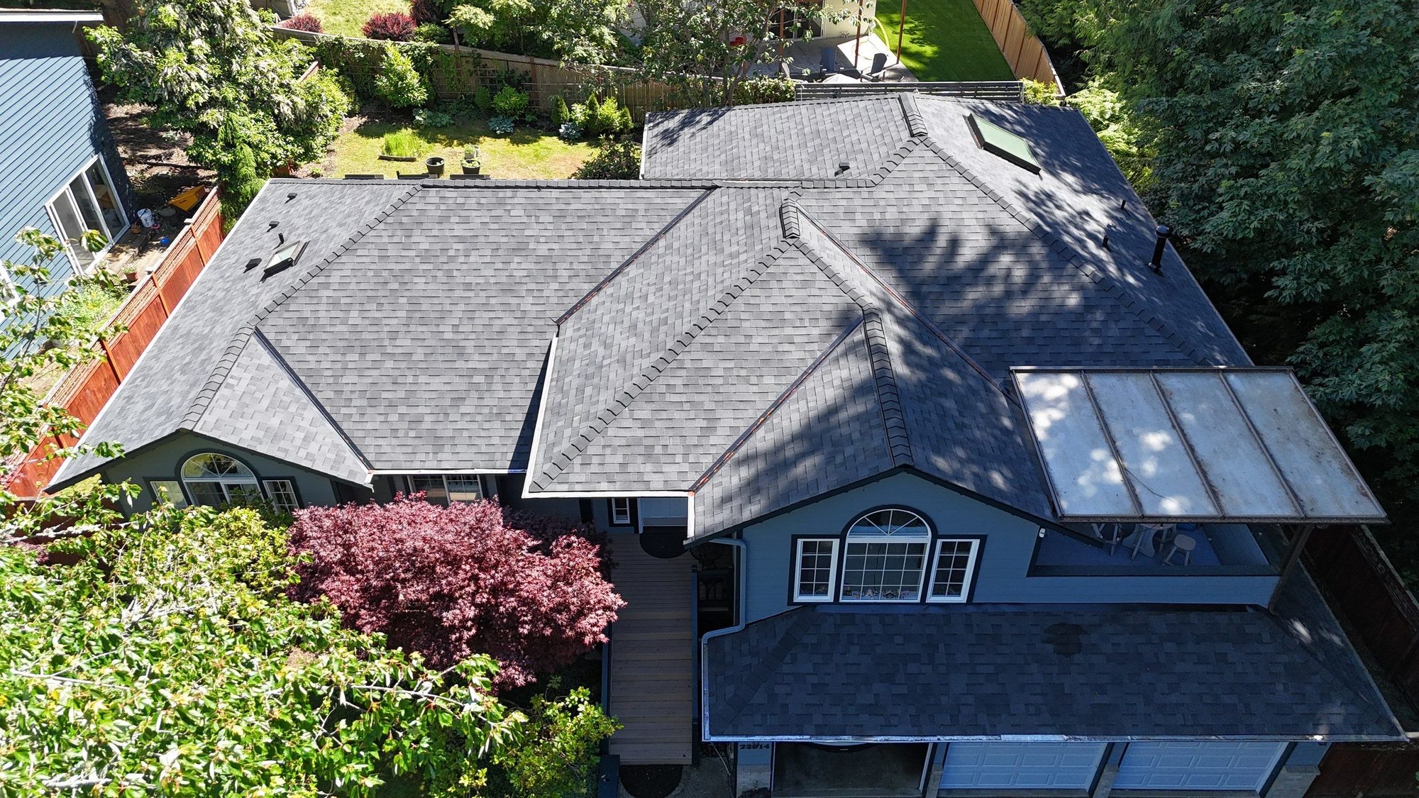 Aerial view of the finished Midnight Black asphalt roof on the Edmonds home