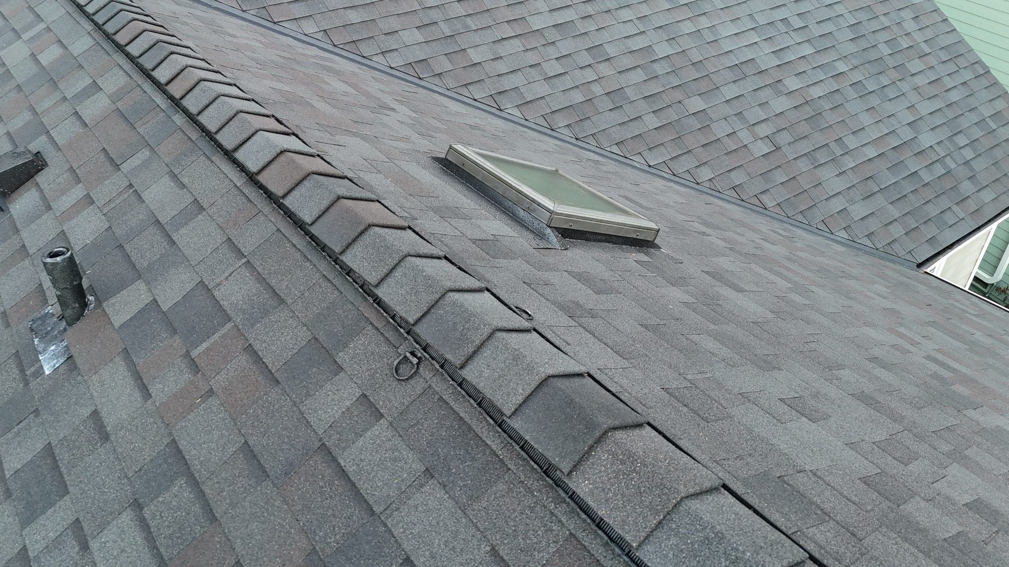 Ridge and skylight of the finished Malarkey Vista Black Oak asphalt shingle roof from above, Snohomish, WA