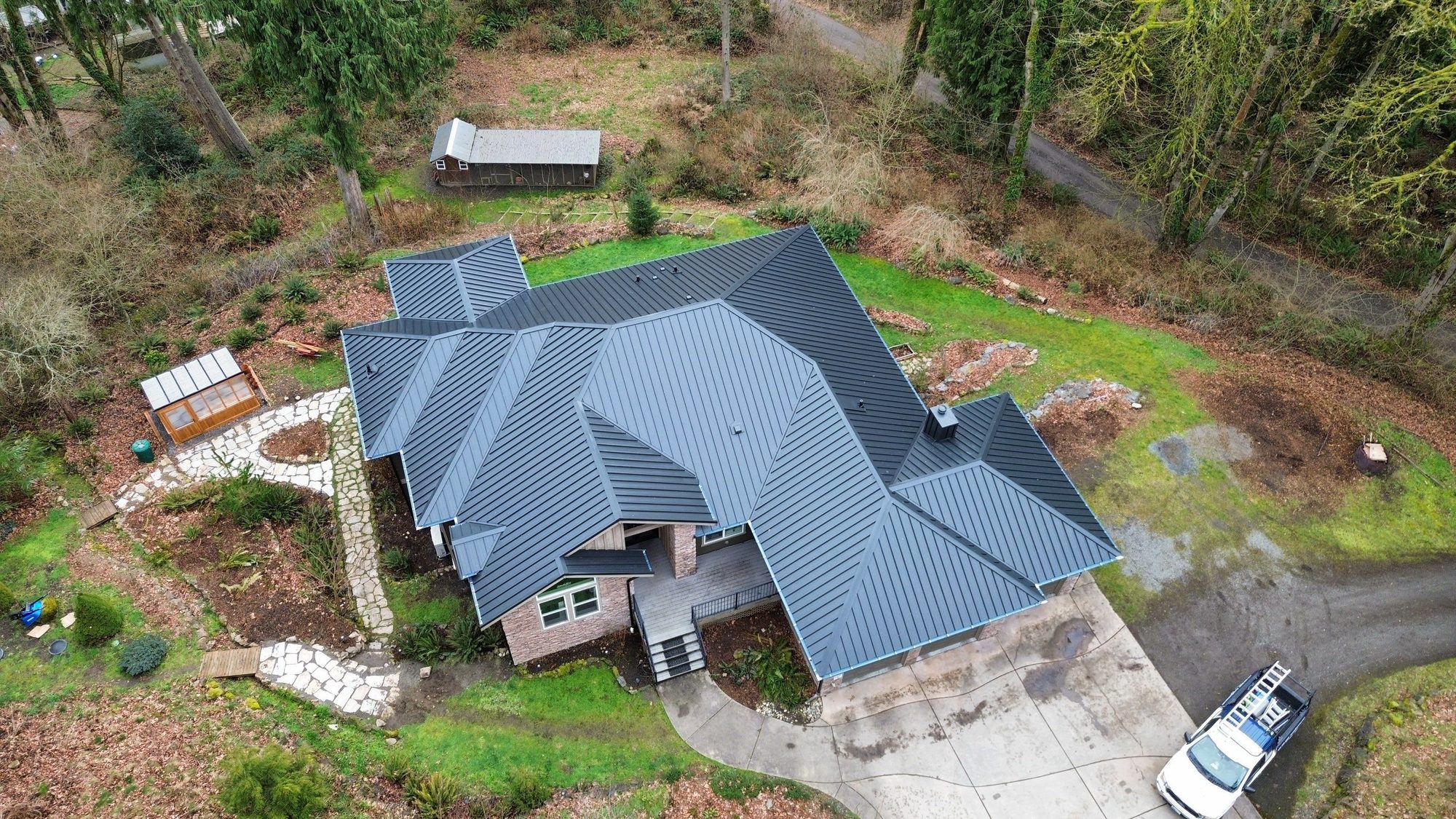 Amor Roofing Matte Black metal roof in Snohomish, full property aerial clean