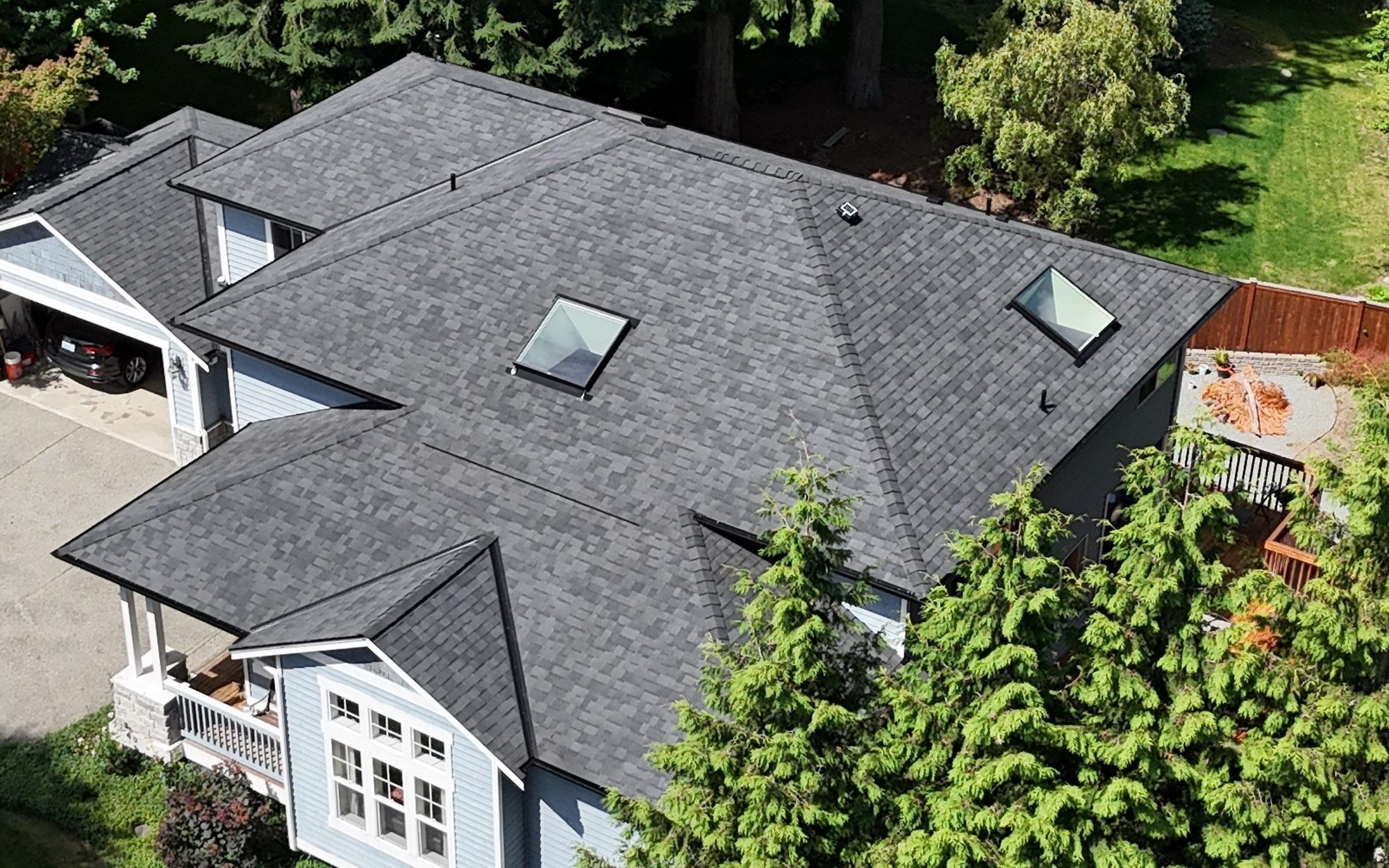 Drone view of the finished Malarkey Legacy Midnight Black asphalt shingle roof with new skylights, Lake Stevens, WA, by Amor Roofing