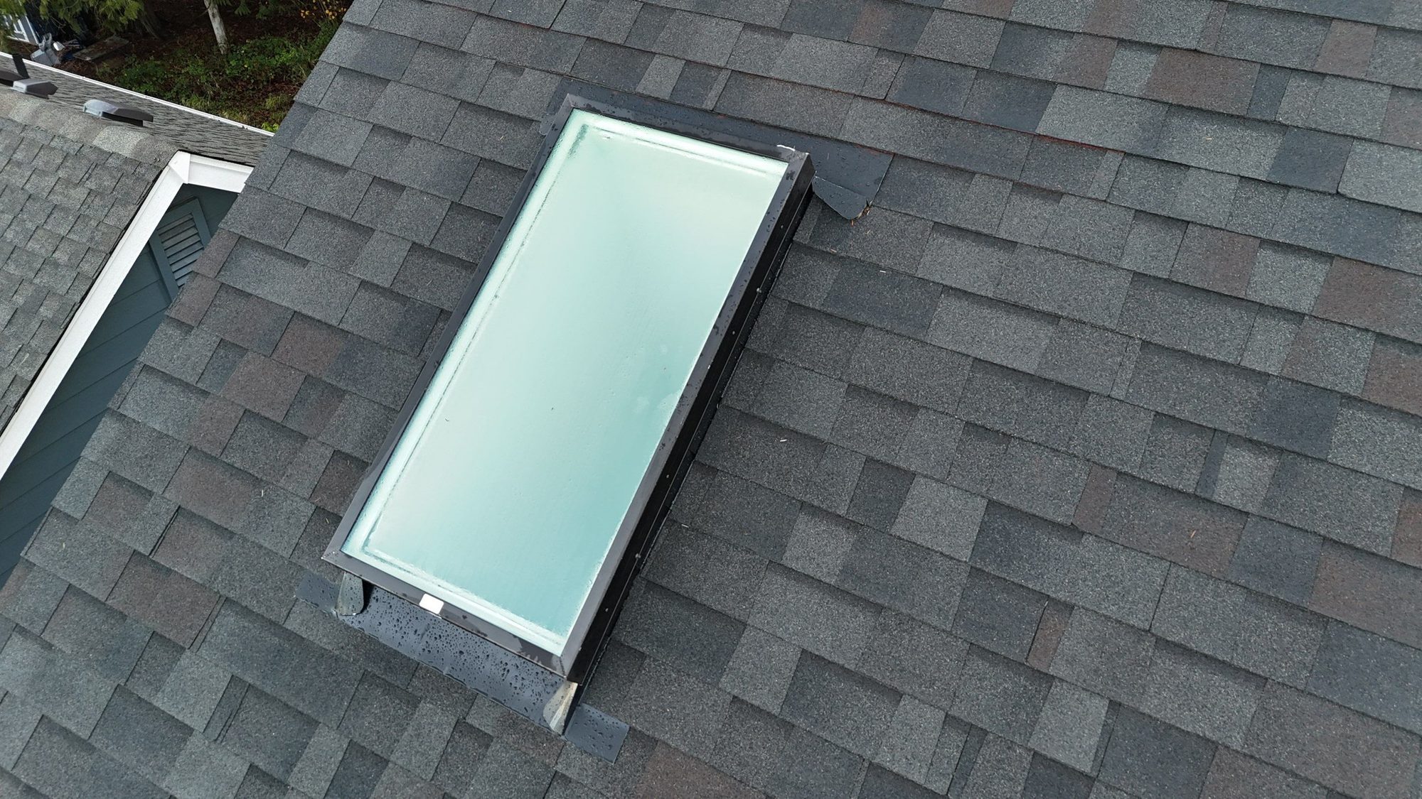 New skylight set into the Malarkey Vista Black Oak asphalt shingle roof, from above, Snohomish, WA