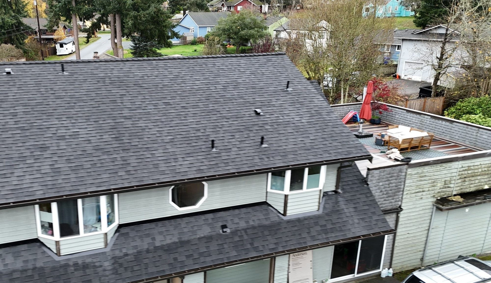Drone view of the finished Malarkey Midnight Black asphalt shingle roof, Everett, WA, by Amor Roofing