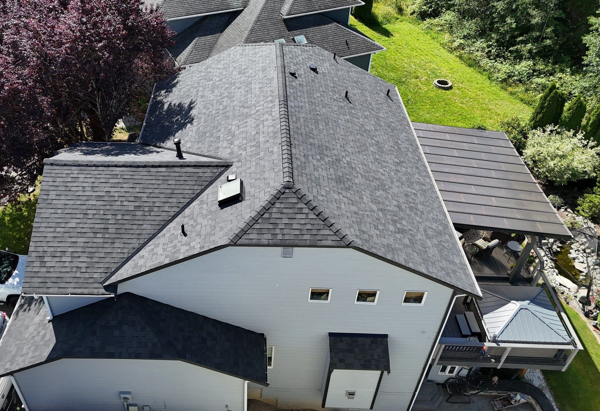 Drone view of the finished Malarkey Midnight Black asphalt shingle roof, Marysville, WA, by Amor Roofing