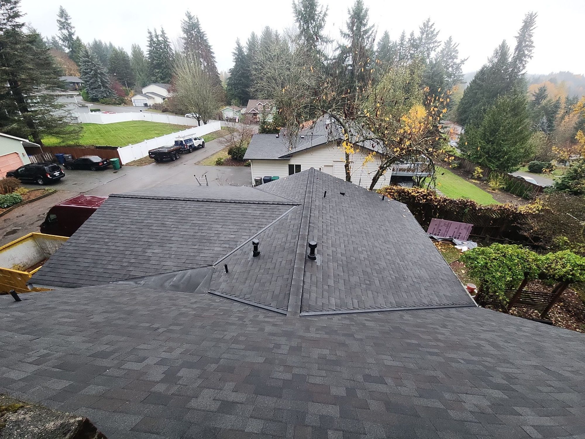 Finished Malarkey Vista Black Oak asphalt shingle roof from above with the neighborhood behind, Woodinville, WA
